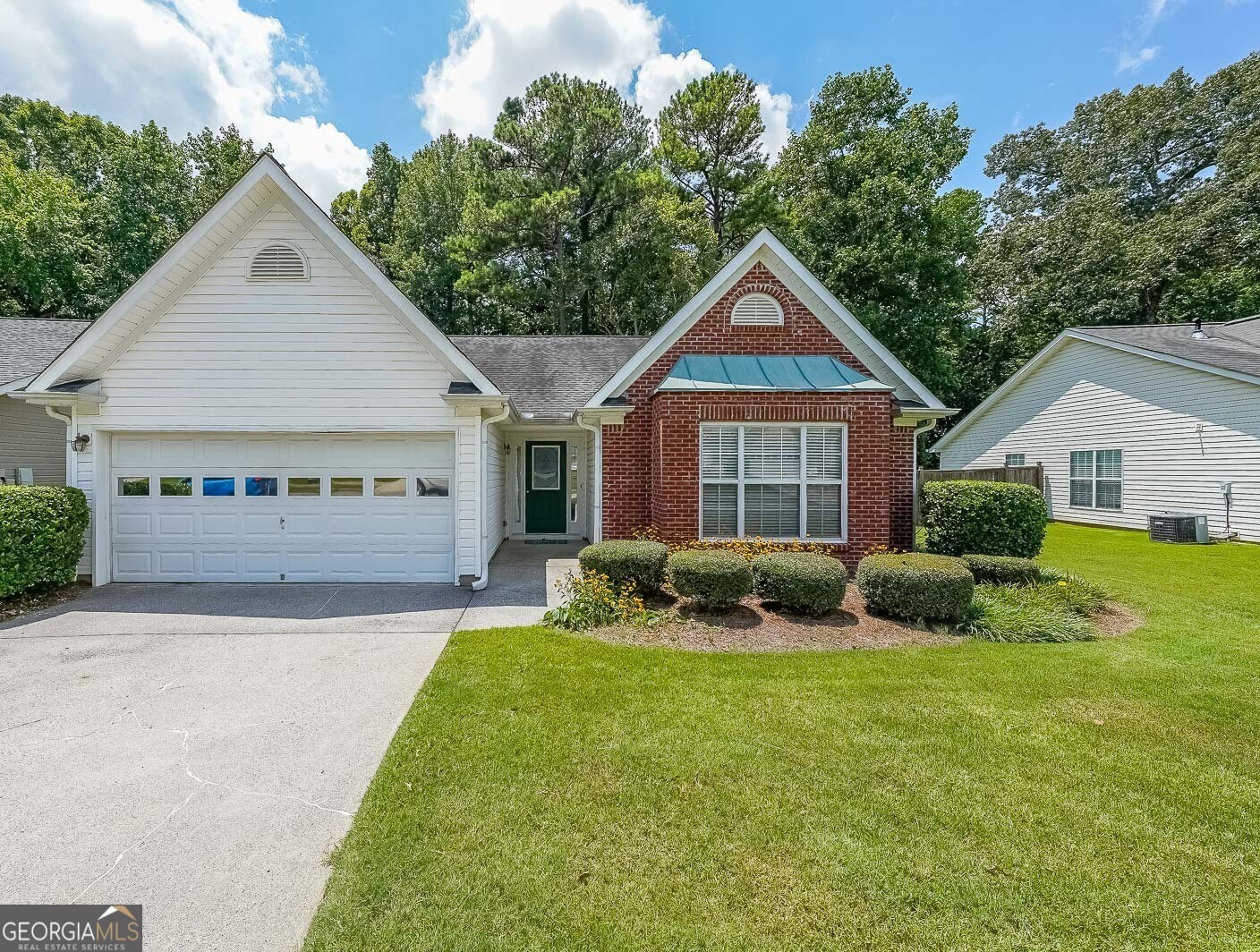 True One level living in sought-after Liberty Commons Swim/Tennis Community. Just minutes from downtown Kennesaw and downtown Acworth. Shopping is right around the corner, as well as a library, resturants, schools, Swift Cantrell Park, and more. This ranch style home boasts maintence free exterior of brick and vinyl, new luxury vinyl flooring throughout, numberous vaulted ceilings, and a split bedroom plan. There are three bedrooms and one of those rooms has a huge oversized window making it a great room for an additional den or office. The kitchen has a new gas stove and is flanked by a eat-in breakfast area and a more formal area serves as a dining room. The large family room has soaring ceilings, a fireplace and gleaming new flooring. The owner's suite is in the back of the home and features ensuite with garden tub and separate shower as well as double vanities and a walk-in closet. The main living area has loads of light with large windows overlooking a patio and with a view of a lovely wooded area. Additional features include: All plumbing pipes have been replaced. Fridge -8 yrs young, dishwasher has been replaced, new roof in 2017.