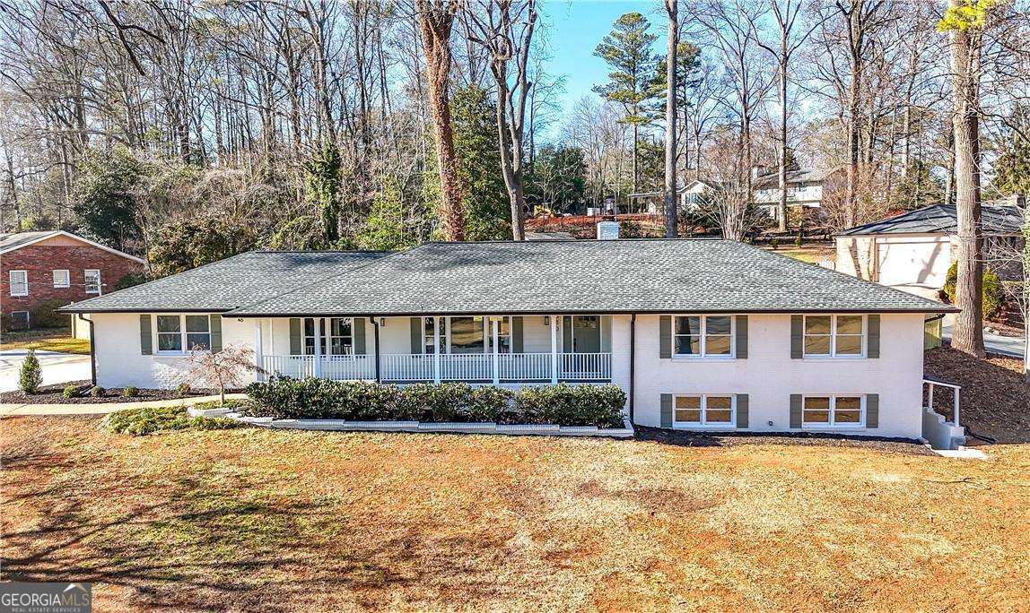 Welcome to this breathtaking modern ranch home, perfectly situated on a spacious corner lot in the heart of Historic Marietta. This four-sided brick gem has been fully remodeled, blending timeless elegance with contemporary style. The brand-new gourmet kitchen is a centerpiece of the home, featuring sleek shaker cabinets, a stunning nine-foot island, quartz countertops, and all new stainless steel appliances, including a 36-inch range and vent hood. It's a dream space for cooking, entertaining, and making lasting memories. The owner's suite, conveniently located on the main level, offers a peaceful retreat with a large bedroom, his-and-hers closets, a luxurious double shower, and a double vanity with quartz countertops. The main floor also includes three additional spacious bedrooms and a beautifully updated guest bathroom, ensuring plenty of space for family or visitors. Downstairs, the finished basement expands your living space with an additional large bedroom, bathroom, and an expansive living room equipped with a stylish dry bar, perfect for entertaining or as a cozy in-law suite. The versatility of this space is unmatched. Outside, unwind in the peaceful sunroom, the ideal spot to enjoy your morning coffee while taking in the serene surroundings. With updates including a new roof, HVAC system, and water heater, this home delivers both modern convenience and worry-free living. This thoughtfully remodeled property combines luxurious living, practicality, and a prime location. Don't miss your chance, schedule a showing today and make this extraordinary home your own! The home also comes with a 1 year termite bond and 1 year lawn fertilization treatment plan from Top Turf.