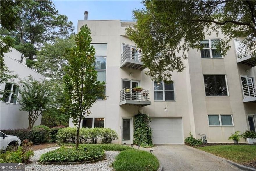 Welcome to this stunning 3-story contemporary townhome located in the heart of Brookhaven! Thoughtfully designed and beautifully updated, this home offers the perfect combination of modern style, functional space, and unbeatable location. The bright, open floor plan of this end-unit features a fireside dining area on the main level overlooking the fully renovated kitchen with quartz countertops and stainless-steel appliances. A convenient half bath and laundry room along with access to the one-car garage complete the main level. The second floor features a spacious living room and a comfortable guest bedroom, both filled with natural light, as well as a beautifully renovated full bathroom. The third floor is dedicated to the oversized primary suite, complete with a renovated en-suite bathroom. Enjoy the rare luxury of six private outdoor spaces, including a rooftop sky deck with incredible views, multiple balconies off the main living areas and bedrooms, and a private, fenced backyard. Natural light fills each floor, enhancing the clean, contemporary lines and comfortable layout. Situated just minutes from Brookhaven Village, this townhome places you in the heart of it all while still offering privacy and tranquility. Quick access to Buckhead, Midtown, and major highways.
