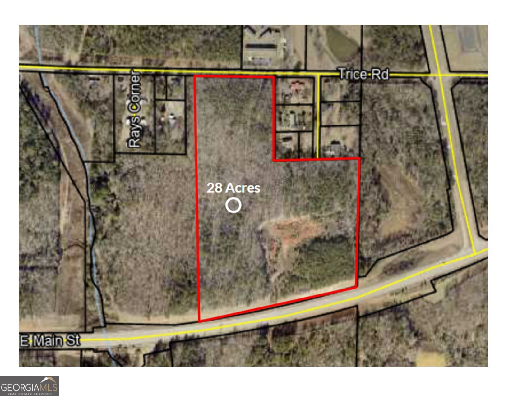 28 acres on Hwy 74 near the public schools within the city limits. Great area for shopping, town homes or apartment complex. Also has access from Hwy Trice Road.