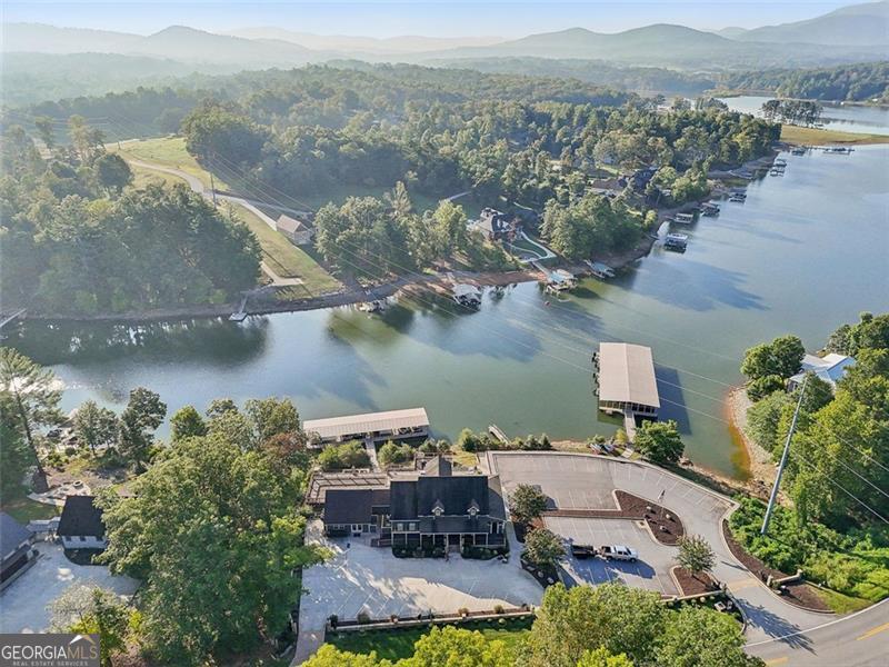 Discover your dream home site with this stunning land lot near Nottely Public Lake, offering breathtaking lake views and serene woodlands. Perfect for a cozy cabin or a luxurious lakeside estate, this property provides direct access to endless outdoor activities like fishing, boating, and hiking. Enjoy peaceful mornings and tranquil evenings in this idyllic sanctuary, far from the hustle and bustle. Don't miss this rare opportunity to own a slice of paradise near one of the region's most beautiful lakes.  Highland Park neighborhood offers a gated community, private lakeside clubhouse, infinity saltwater pool, fitness center, game room, playroom, movie room, kitchen, social area, lake access. Nestled in the mountains and minutes from downtown Blairsville. Butternut Creek Golf course is close and shopping, restaurants, and Vogel state park are near by. Enjoy some of Georgia's beautiful waterfalls , enjoy fishing, and nature trails and mountain views. 20 minutes from GA's highest point, Brasstown Bald. 30 minutes from Harrah's Cherokee casino. Clients must enter gate with their agent and agents need the secure gate code that I will provide.