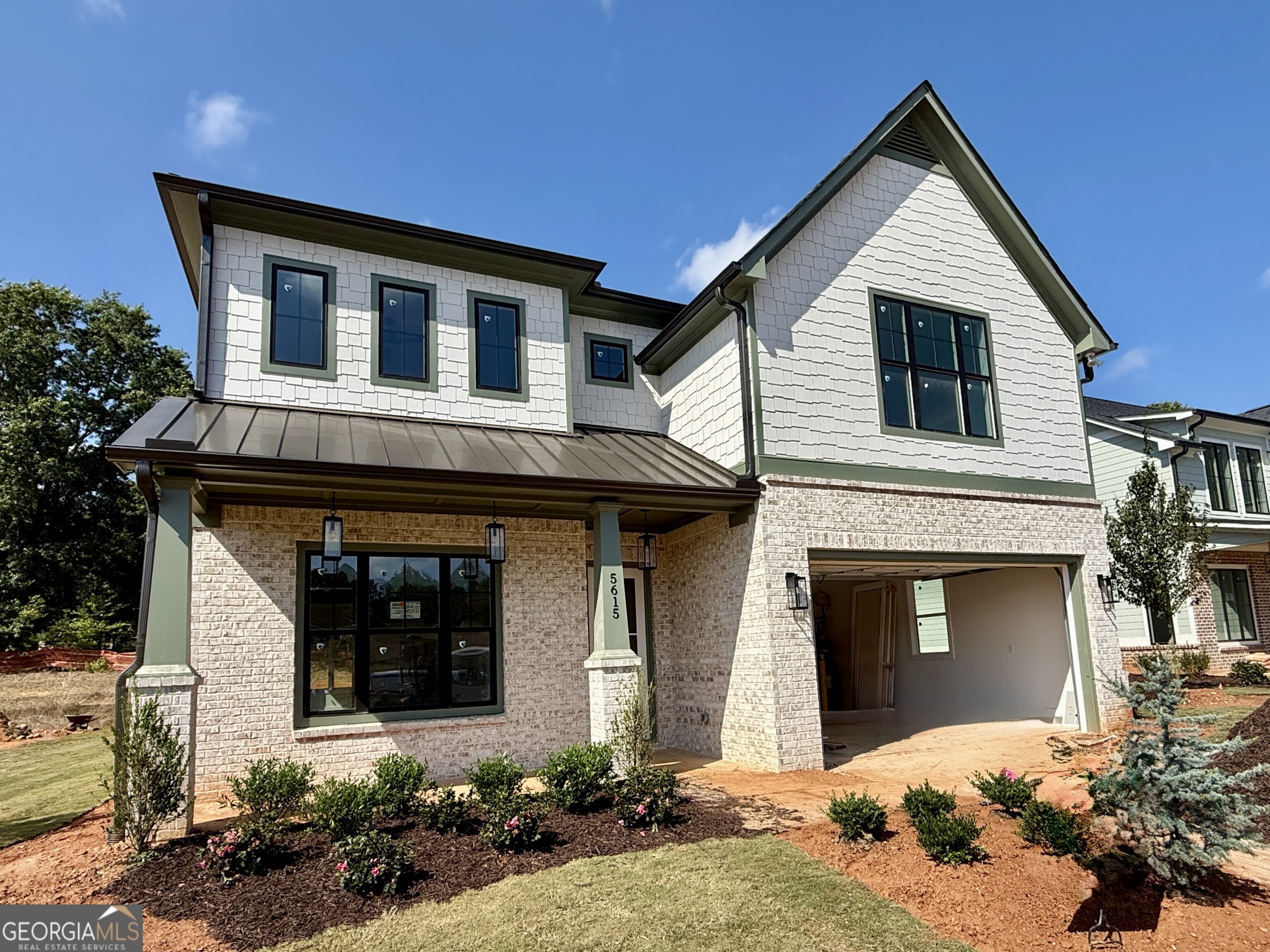 The Melissa Plan built by Heatherland Homes. This beautifully designed home is in one of Northwest Cobb's newest and most convenient communities just 2 miles from top-rated Harrison High School and is Move In Ready just for you! This home features 10' ceilings and 8' doors, hardwood floors in the main living areas and primary bedroom, and detailed trim work throughout. Every bedroom has its own en-suite bathroom, offering comfort and privacy for all. The main-level primary suite includes a private door to the covered patio, dual quartz vanities with transom windows, a spacious walk-in closet, and a wet-room style tiled shower with a large soaking tub it feels like a retreat. The kitchen is equally impressive with quartz countertops, ceiling-height soft-close cabinetry, KitchenAid double ovens & gas cooktop, and a large island perfect for gathering. Upstairs, you'll find three spacious bedrooms and a generous loft space. Model Home Now Open. Schedule your tour today! Limited time offer with Special inventory pricing! As about our $20,000 Any Way You Want It* incentive with the use of the preferred lender with binding contract by 08/30/2025. Incentive is homesite specific. Quick Move-In!