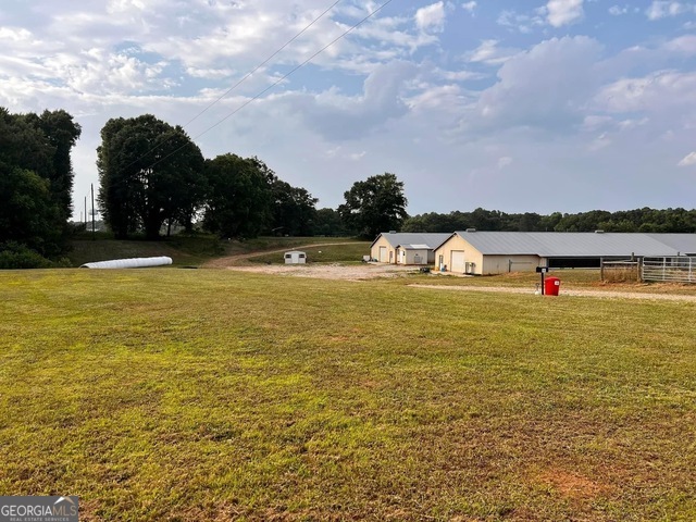 Rare opportunity to own the only breeder farm currently on the market within a wide radius! This 35-acre property is fully fenced and cross-fenced, with a well and septic tank already in place and multiple potential home sites. Living quarters are already on site, providing immediate convenience for owners or farm workers. The farm features two 40x530 breeder houses, originally built in 2004 and completely remodeled three years ago. Upgrades include new fans, baffles, feeders, drinkers, LED lights, egg collection tables, belts, and a commercial cooler-making the houses practically like new. A transferable A contract is in place, making this a turnkey operation for anyone looking to invest in the poultry industry. Don't miss out on this exceptional opportunity! Appointment is required to view this farm.
