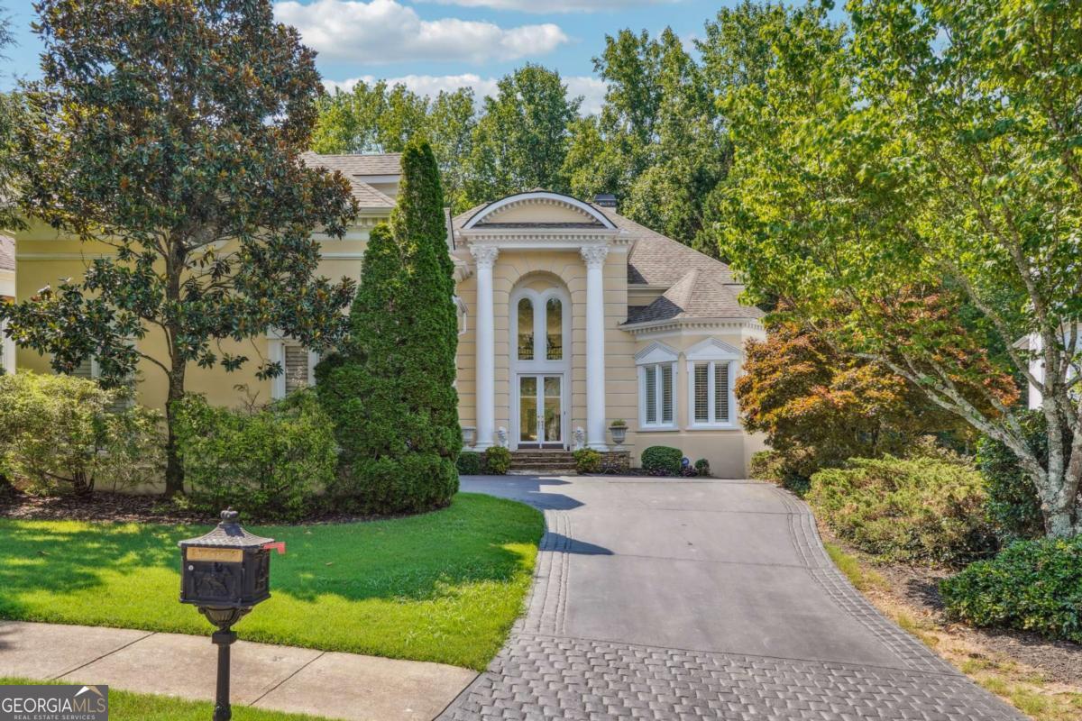 Experience three fully finished levels of exceptional living space in the prestigious gated enclave of Greatwood Glen within the sought-after Windward community. Ideally located in North Fulton, this home is adjacent to the Golf Club of Georgia. Boasting five bedrooms and five and a half bathrooms, this residence offers generous living space and upscale features throughout. Home has four elegant fireplaces with custom mantels and both the main and terrace levels are open to beautiful walkout patios and balconies. The finished terrace level includes a full bedroom and bath, a spacious bar area, and multiple flex rooms ideal for a home gym, media room or additional bedrooms.