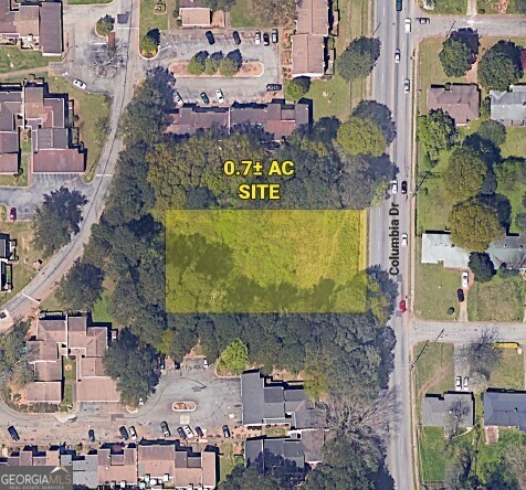 0.7 acre tract ideal for residential development. Approvals are in place for 6 townhomes.