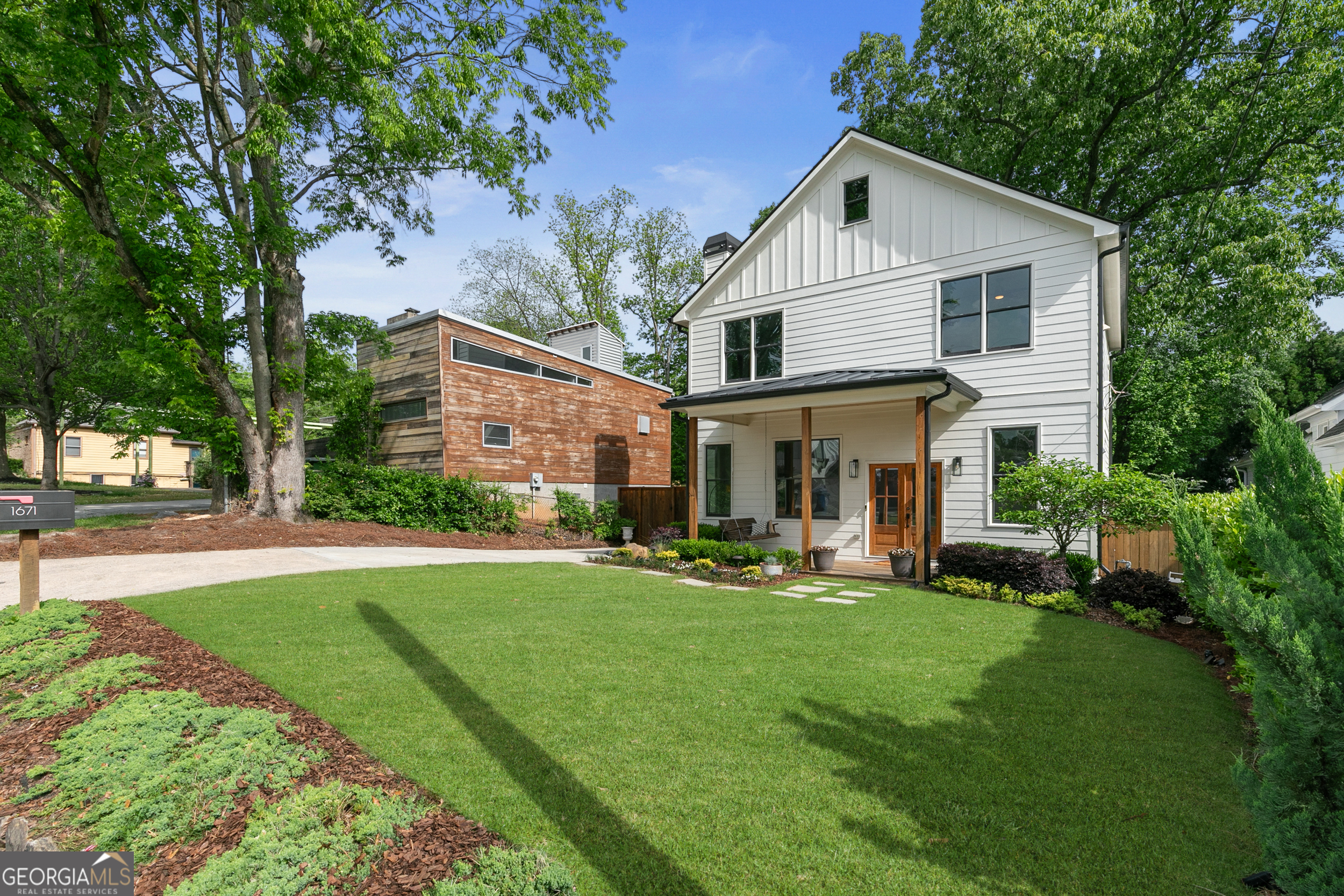 Seller offering a $5,000 Contribution towards closing cost or interest rate buy down with full price offer!! Step into southern charm with this stunning custom farmhouse, perfectly placed in the sought after Hills Park neighborhood of West Midtown. The welcoming front porch, ten foot ceilings, floor to ceiling cabinetry, warm hardwood floors throughout, and lots of natural light brings a sense of openess and sophistication you won't find anywhere else. Both the kitchen island and dining space providing ample room for food prep and multiple seating options. Enjoy peaceful mornings or evenings with a cup of coffee or delightful glass of sweet tea on the oversized screened-in porch or entertain in the huge backyard, perfect for kids and a garden. The luxurious owners retreat features two separate marble vanities, a walk in closet, a large glass shower, and a 70 inch soaking tub to relax after a long day. Every detail of this thoughtfully designed home was captured to provide a sense of comfort and timeless style. Located just minutes from The Westside Reservoir park, the Belt-line, lots of dining and shopping options, "The works", and recreational fun at Top golf, you're sure to benefit from the neighborhood attractions all without paying a HOA. This home is a must see!