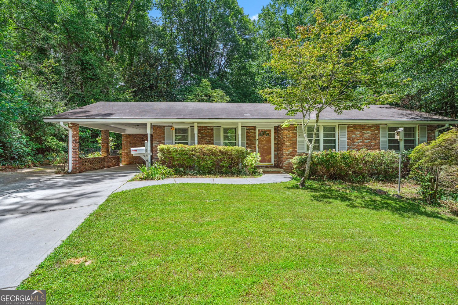 Welcome to this charming 1960s four-sided brick ranch, offering single-story living with timeless elegance. Hardwood floors grace the entire home, even under the carpet in the bedrooms and hall. The spacious eat-in kitchen with a breakfast nook opens onto a patio through sliding glass doors, perfect for entertaining. Enjoy three large bedrooms with ample closet space and one and a half baths. The oversized living room offers versatile space that can also be a Living Room/ Dining Room Combo. The private fenced backyard features beautiful landscaping with established trees and a large shed for storage. A one-car carport and the long driveway add convenience and plenty of parking to this delightful home. This home is located around the corner from a City of Tucker park boasting walking trails, a playground, dog parks, park benches, and a gazebo. With easy highway access and close proximity to shopping, restaurants, entertainment, plus Emory Hospital and the CDC, this home keeps you connected to all the best Metro Atlanta has to offer.