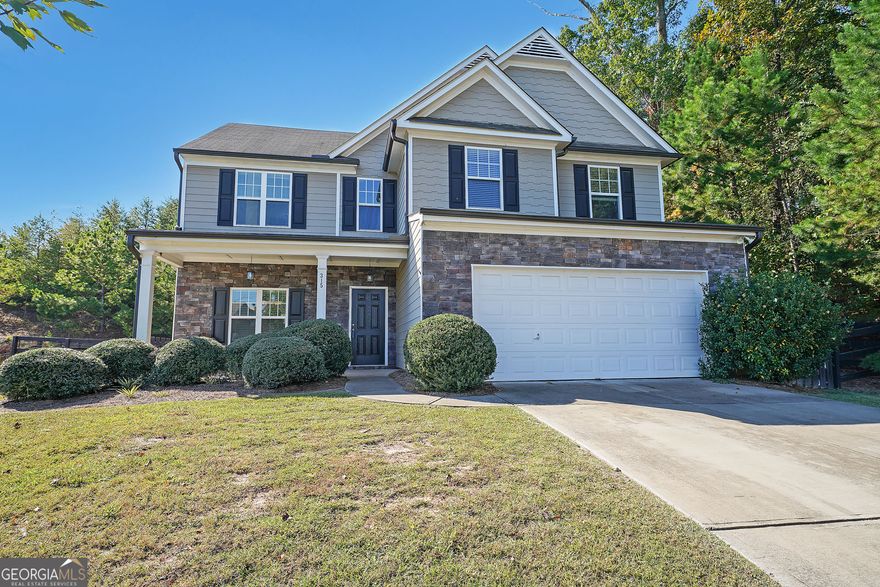 || LEVEL CUL-DE-SAC LOT WITH WOODED PRIVACY || || NEW AC UNIT (2024) WITH WARRANTY || || $5,000 GARAGE CABINET SYSTEM WITH SINK OPTION || || CLOSE TO DOWNTOWN BALL GROUND ||  || NO RENT RESTRICTIONS || ** What You'll See **  From the moment you arrive, you'll notice the LEVEL CUL-DE-SAC LOT surrounded by mature trees that provide a sense of peace and WOODED PRIVACY on one side that will never be built on. Inside, the heart of the home features GRANITE COUNTERS, a KITCHEN ISLAND, and a WALK-IN PANTRY-perfect for keeping everything organized and in view. The OVERSIZED MASTER SUITE is a true retreat, complete with HIS & HERS CLOSETS, a SEPARATE SHOWER, and a SOAKING TUB to unwind in style. ** What You'll Hear **  Listen to the quiet that comes from living on a CUL-DE-SAC LOT, where traffic is minimal and evenings are calm. Step into the HUGE FENCED YARD and you'll hear the soft rustle of leaves from the wooded edge, offering a natural soundtrack of privacy and serenity. ** What You'll Feel **  Feel the comfort of knowing your home is well cared for-with a NEW AC UNIT (2024) still under warranty and top-of-the-line GARAGE CABINETS worth $5,000, complete with a SINK OPTION for convenience. The warmth of the natural light throughout the home, combined with the sense of space from the open floor plan, gives a welcoming and relaxed energy. ** What You'll Experience **  Experience the ease of modern living with all APPLIANCES INCLUDED-a FRONT-LOAD WASHER & DRYER and REFRIGERATOR from when the home was first built. The HUGE FENCED YARD offers space for pets, play, or entertaining under the trees. Located just minutes from DOWNTOWN BALL GROUND, you'll enjoy local restaurants, shops, and community events while still feeling tucked away in your own private retreat.