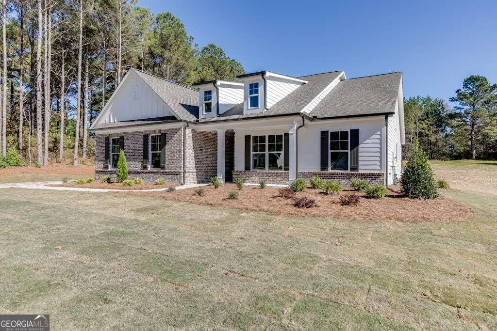 Are you seeking a NEW home on a LARGE lot that is NOT IN A SUBDIVISION & NO HOA?! THIS IS IT!!! Introducing The Estates at Nunnally Farms, a 10 Home Contemporary Farmhouse Estate Lot development located in Walton Co, GA with LARGE FLAT LOTS & NO HOA! 5 Homes Still Available...This ranch home features 4 bedrooms, 3 baths, a side entry 2-car garage, covered back porch, loads of privacy, & more! The oversized kitchen island gives way to an open concept living area complete with natural gas fireplace. The primary suite is privately tucked away, features a luxurious "spa-like" tiled primary suite bath shower & large walk-in closet. Fire your grill up and enjoy the outdoors with the oversized covered back patio overlooking your private backyard space perfect for family gatherings & game day celebrations! HUGE LOT! Ready for quick move-in! ASK ABOUT OUR CURRENT INCENTIVES!