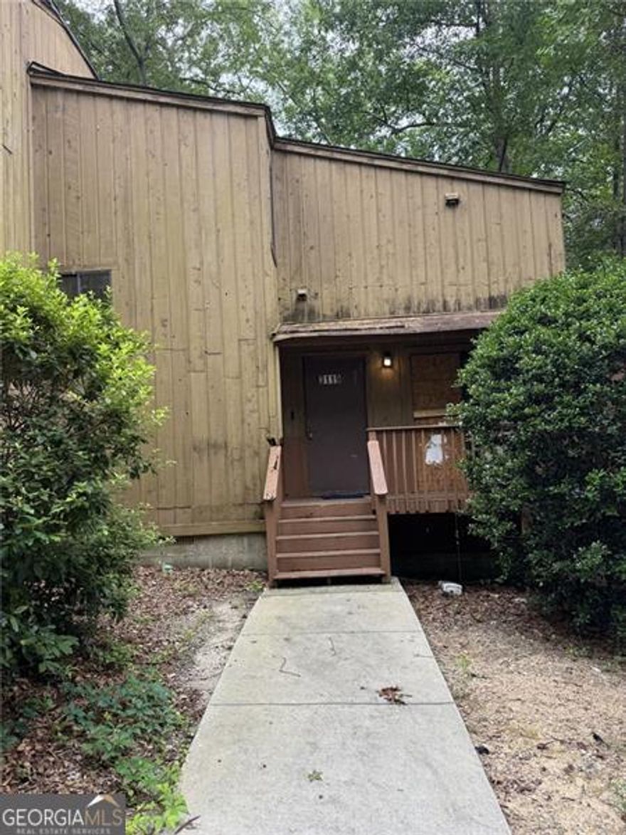 This 2-bedroom, 1.5-bath, two-story townhome offers excellent potential for renovation and customization. Conveniently located just minutes from I-20 and near a MARTA bus route, the property provides quick access to major highways and public transportation. The home features a functional layout with spacious bedrooms and is being sold as-is, allowing the buyer to make improvements to suit their needs.