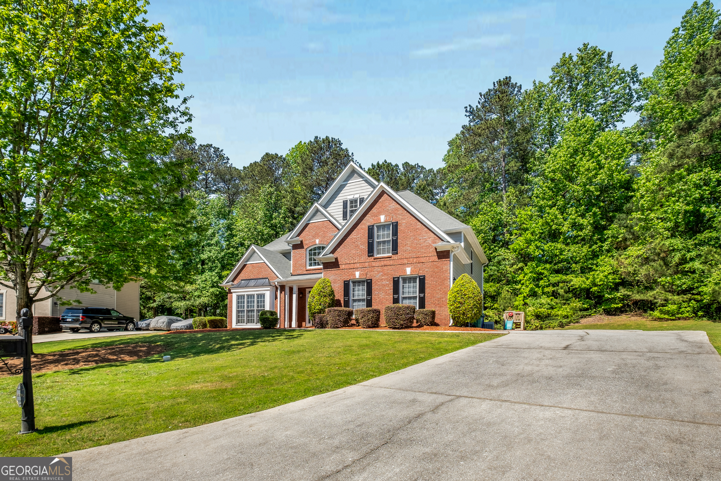 This meticulously maintained two-story home welcomes you with an open-concept design, featuring a striking two-story foyer and family room. On the main level, you'll find a bedroom and bathroom, providing convenience and flexibility for guests or multi-generational living. The side entry garage adds to the curb appeal and functionality of the property. Residents of this community enjoy access to a range of amenities, including a swimming pool, tennis courts, walking trails, and a picturesque lake. A clubhouse offers opportunities for social gatherings and community events. Conveniently located near Stone Mountain Park, this home provides easy access to outdoor recreation, scenic trails, and family-friendly attractions. With its blend of modern design, functional layout, and proximity to leisure activities, this property offers an ideal balance of comfort and lifestyle.