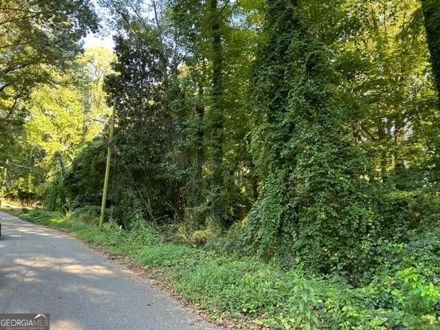 1.46 Acres - Want to Build in Atlanta? Zoned Residential and tucked away on a quiet, established street near Metropolitan Parkway, this 1.46acre lot is your blank canvas. Minutes to I85, Hartsfield Jackson airport, grocery store, new Goodwill nearby. Surrounded by existing homes in an area seeing future growth. No survey. Selling As Is. Motivated seller - bring your vision and make it yours today!
