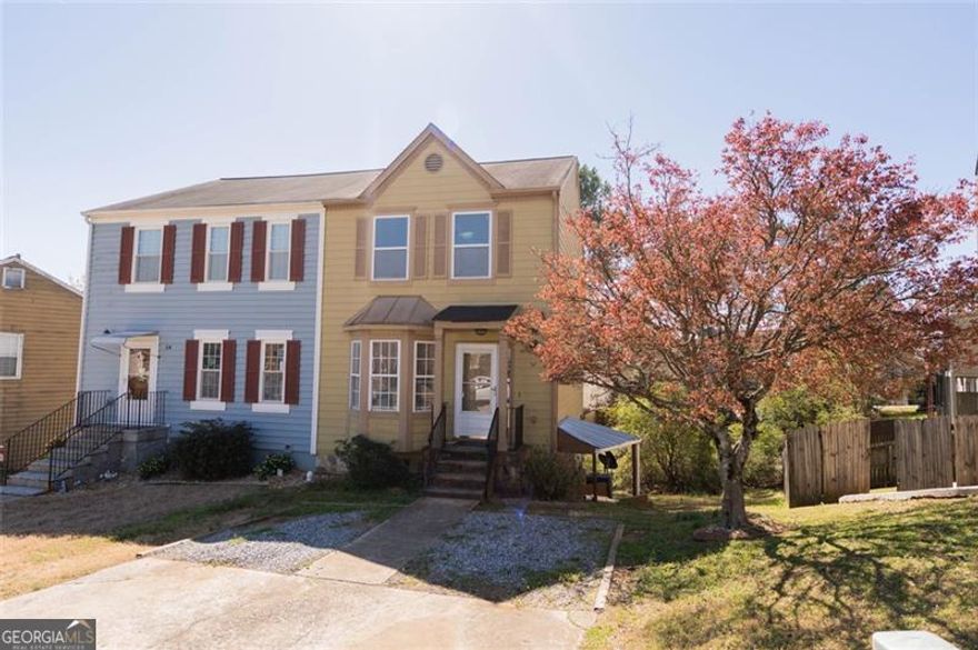 UTILITIES INCLUDED!!    Discover this beautifully renovated 2-bedroom, 2.5-bath townhome in the heart of East Cobb, just minutes from shopping centers, Marietta Square, Town Center Mall, Kennesaw State University (KSU), and with easy access to I-75. This charming home features hardwood floors throughout, a spacious open-concept main level with a cozy fireplace, and a modern kitchen with plenty of cabinet space. Upstairs, you'll find two master bedrooms, each with its own private en-suite bathroom, separated by a convenient laundry room with washer/dryer hookups. A French door leads to a private covered back deck, perfect for outdoor relaxation. With utilities included-gas, electricity, water, and garbage-you can enjoy worry-free living for just $1,900/month. The home also offers two assigned parking spaces for added convenience. Don't miss this incredible opportunity to live in a prime location with everything you need at your fingertips! Hablamos espanol -schedule your tour today!  The property offered for lease is the main floor and upper level, while a separate terrace-level apartment is already leased. Each residence features its own private entrance, providing a sense of exclusivity and convenience.