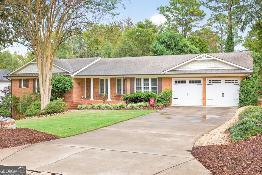 Family Friendly Neighborhood within all things ATHENS and UGA!!! This stunning 4 sided brick, 3BR, 3Bath home is perfect for those who want to enjoy Athens the "Family way" and still be close to so many amenities. Upon entering the front door, you cannot help but notice the gorgeous Hardwood floors and plantation shutters throughout this home. Total open concept with high vaulted ceiling in the main living area that flows directly into the kitchen featuring a massive island easily seating 8 people along with a breakfast area. Upgrades galore complete with high end Jennair stainless steel appliances to include a fantastic gas stove, separate microwave, oven/convection oven. The brick wall accent adds that warm and inviting feeling. Off the kitchen is a mud room opening to a screened in porch and attached garage. An amazing feature of this home is the ability to have 3 master bedrooms. On the main level you will encounter a large Master BR with trey ceiling, tiled Master Bath, walk in closet.  The second bedroom could also serve as a master with an attached bath and walk in closet.  Home features a lower level with open stairs making it feel a part of the home and not a basement. the 3rd bedroom again is complete with trey ceiling, an in suite tiled bath and large closet. The lower level has endless possibilities as a second den, exercise room, office, playroom etc. There is also a privet entrance from the outside making this a possible in-law suite. You will find this house to have great curb appeal with attractive landscaping and mature trees in both the front and fully fenced backyard. Deck has recently been remodeled making it the perfect setting for entertaining and kids playing. Located in the are of Five Points you are close to so many restaurants, shopping and one of Athens special features Bear Hollow Zoo (walking through neighborhood trail) great for running, picnics and being one with nature. Very close to the University of Georgia and so much more.