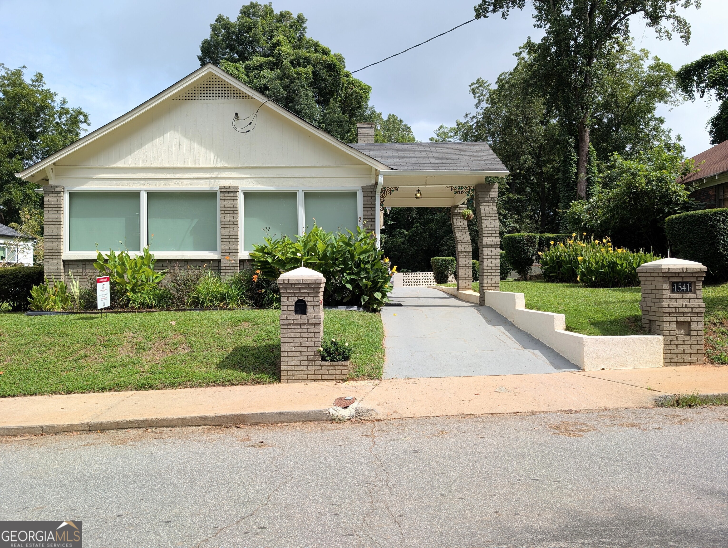 Updated Grove Park Bungalow. This home is eligible for Special 100% financing with NO PMI & below market rates. Featuring a new roof, new HVAC, new water heater, and new windows. Oversized kitchen with ample cabinet space and butcher block countertops. This home delivers worry-free living from day one. Inside, you'll find hardwood and tile floors, a bright sunroom with central heating and air, and an open layout that's perfect for entertaining or relaxing. The spacious rear deck overlooks a private backyard complete with a charming swing. Plenty of parking on-site, a rare find in this neighborhood. Conveniently located near Westside Park, the Atlanta BeltLine, and quick access to downtown, Midtown, and major interstates.