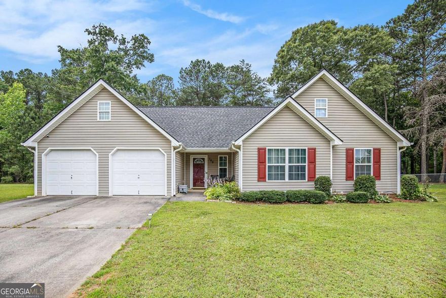 Charming ranch with modern updates, conveniently located in proximity to shopping and dining! Welcome to this beautifully maintained 3-bedroom, 2-bath ranch-style home featuring recently installed luxury vinyl plank flooring and newer water heater. Enjoy the inviting curb appeal with a covered front porch and a nicely manicured front yard that adds to the home's welcoming feel. Inside, you'll find neutral paint tones and a wood burning fireplace that creates warmth and ambience. Delightful kitchen is equipped with a stylish backsplash, freshly painted cabinets, and ample counter space. The spacious primary suite offers a relaxing retreat with a tray ceiling, soaking tub, separate shower, and the right amount of space for comfort. Additional highlights include a two-car garage, a large level backyard with a patio designed for outdoor gatherings, and a layout that offers functionality. This home is move-in ready and waiting for its next chapter!