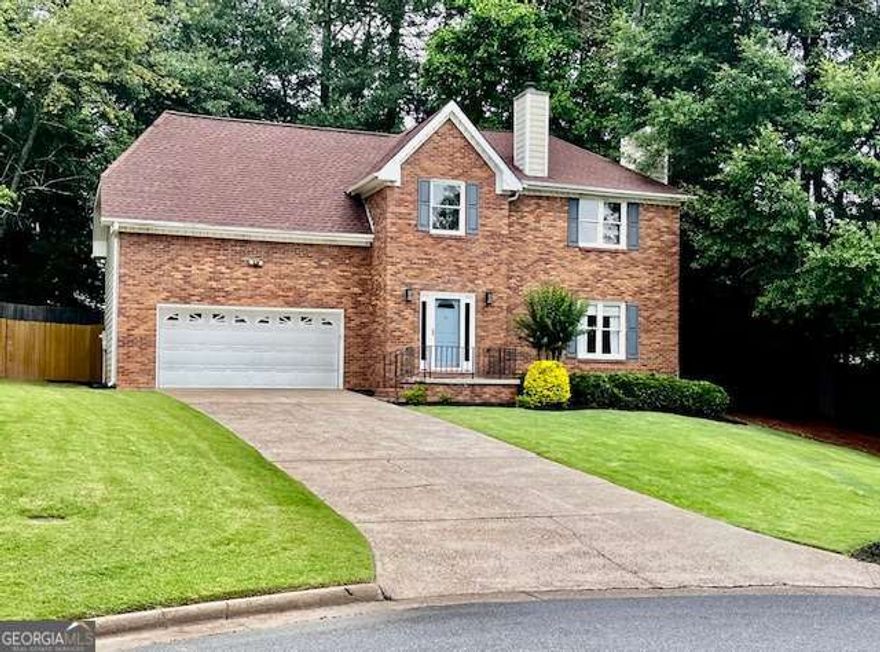 Welcome to your dream home in the heart of East Cobb Georgia! This beautiful traditional two-story brick-front residence offers charm, space, and modern updates-all tucked away on a quiet cul-de-sac for added peace and privacy.  Step inside to find a spacious layout featuring 3 bedrooms and 2 1/2 bathrooms, including a stunning updated primary suite. The master bedroom boasts a custom-built walk-in closet (16x9) with natural light and an elegant en-suite bathroom featuring dual vanities and spa like soaking tub-a perfect retreat after a long day.  Enjoy meals in the bright eat-in kitchen with a clear view of the private, tree-lined backyard, creating the perfect atmosphere for both daily living and entertaining. Upstairs, you'll find LVP flooring in the hallway, adding warmth and style. Step outside to your own outdoor oasis-a large brand-new deck (28x14) with plenty of built-in seating, ideal for summer gatherings, morning coffee, or quiet evenings. The fully fenced backyard offers space, shade, and privacy, making it ideal for all lifestyles.  Located just minutes from top-rated schools (WALTON HIGH SCHOOL), fantastic shopping, and some of East Cobb's best dining spots-this home truly has it all.