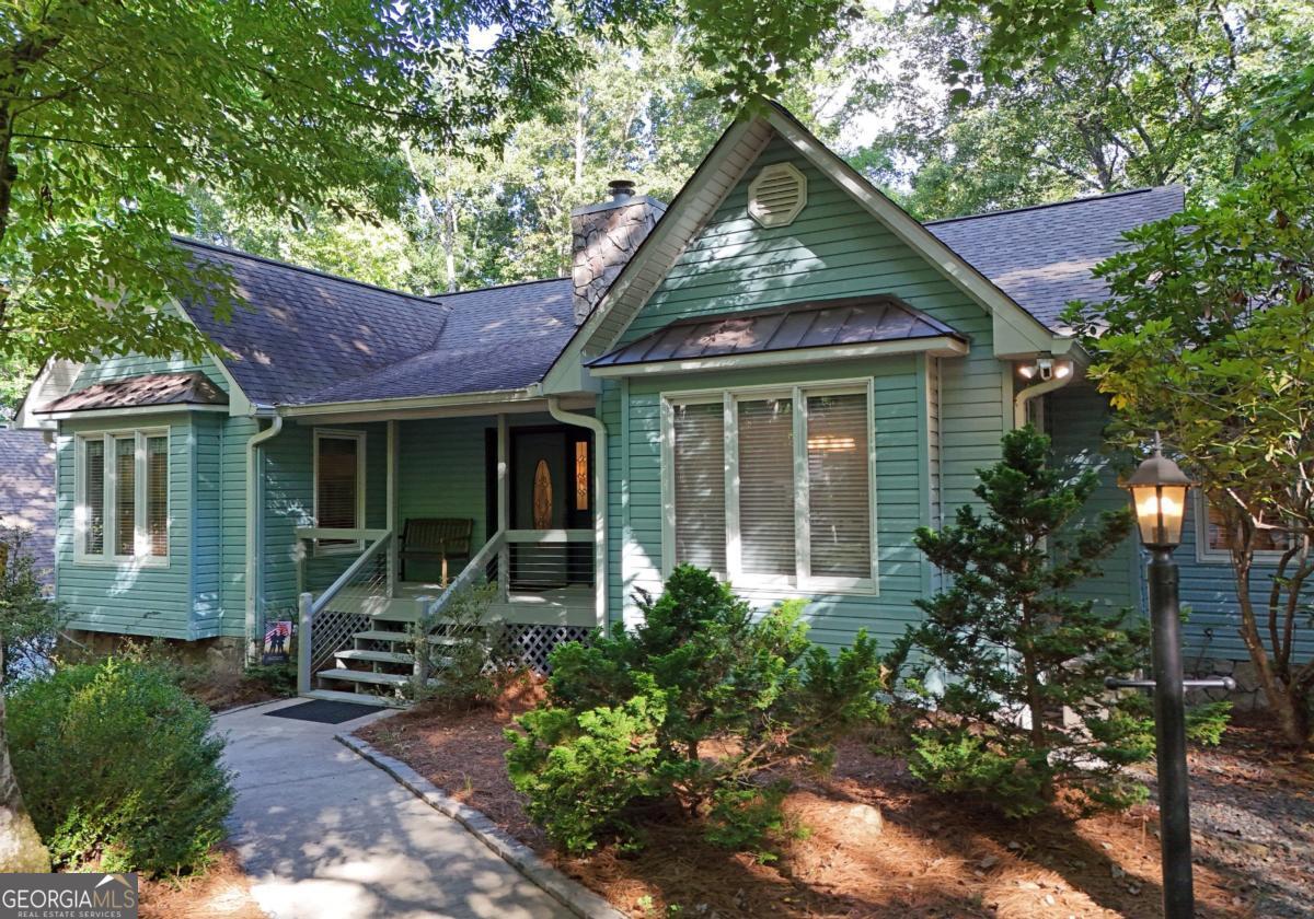 Immaculate Home under 2 miles to Town. Car Enthusiasts LISTEN!!! 2 Car 30x30 Detached Garage Plus 2 car parking in lower level of this 4BR/3BA Traditional. 1832 SQ FT Per floor. Main floor features 3BR/2BA w/ Formal entry foyer, Vaulted spacious Living room, Wood Floors, gas log fplc, Updated Kitchen with granite tops and stainless appliances, Large dining area. Laundry Room. Primary suite has bath w/ jetted tub plus shower, dbl vanity. Beautiful Sunroom can be enjoyed from the primary suite or the Living Room. Marvin windows and Anderson doors! Double Decks on the back overlooking Wellborn Branch. Lower level has Epoxy flooring in 2 car garage. 2 Large finished rooms , one with wet bar, and the other with built in display cabinets for your collectables. 6YR old Roof! Circular paved drive / main floor parking. Low maintenance vinyl siding. Beautifully maintained and well loved home. 1 mile to Hospital. Easy access to town. Close to Lake Nottely and Butternut Creek Golf Course. This is a Winner.