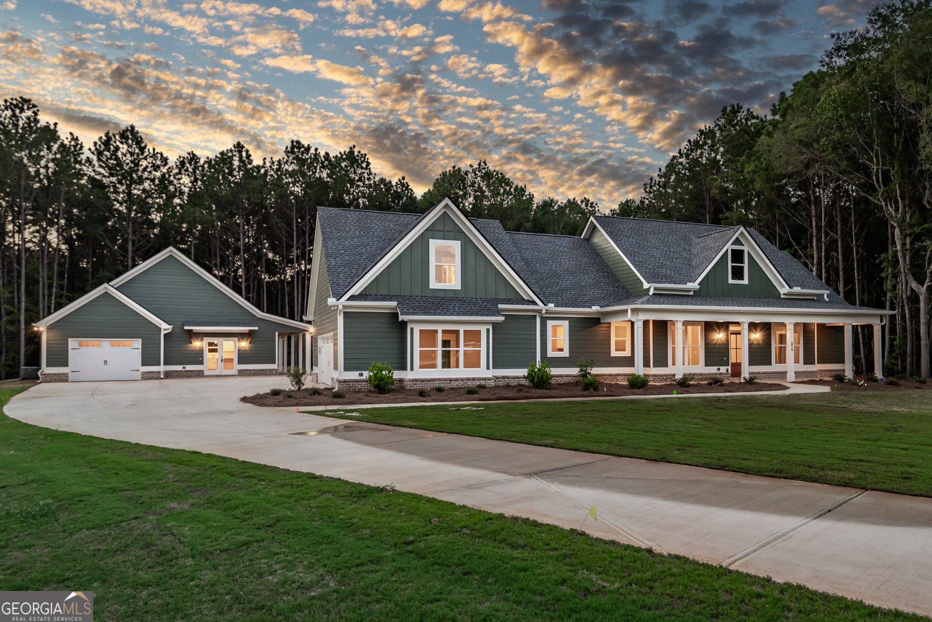 Stunning Home with Guest House on 2.475 Acres in Social Circle! Located on a quiet cul-de-sac just minutes from downtown Monroe and Madison. This property offers the perfect blend of charm, space, and versatility. The main home welcomes you with a large front porch and features an open concept design. A vaulted great room with exposed beams and a brick fireplace flows seamlessly into the dining room and the bright all-white kitchen. The kitchen is equipped with a large island, stainless appliances, wall oven and microwave combo, tile backsplash, and plenty of cabinetry. The main level owner's suite boasts two walk-in closets, a spa-like bath with tiled shower, and dual vanities. An additional guest bedroom and full bath, along with a large laundry room, complete the main floor. Upstairs, you'll find another bedroom, an office, and a spacious loft/flex area. Enjoy outdoor living on the oversized back porch with its own cozy fireplace. The main home also includes a two-car garage. The property's one-bedroom guest house is a rare find, complete with a single-car garage, a large porch, and approx. 800 sq.ft. of private living space-perfect for extended family, guests, or an income opportunity. Sitting on 2.475 beautiful acres, this property combines convenience, privacy, and functionality in one of the most desirable areas of Social Circle.