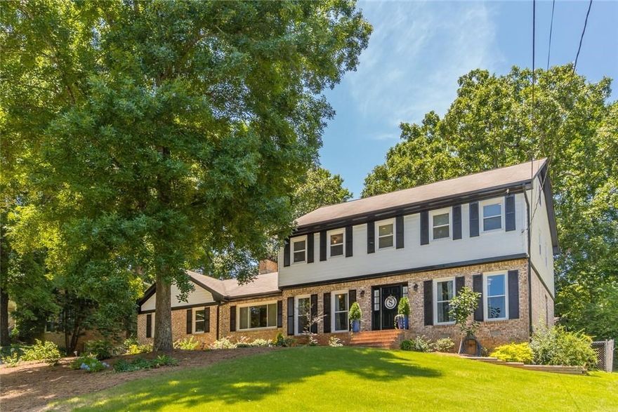 Meticulously maintained Dunwoody Four Sided Brick 4 Bedroom/3 Bathroom home in trendy Meadowlake Community located a short walk from Vanderlyn ES & Dunwoody High! Beautiful Front Yard and large park-like walkout fenced backyard w huge Patio for entertaining. Freshly painted inside & out w hardwoods Up/Down & guest suite on main level. Updated kitchen with white cabinets, Granite and Stainless Steel Appliances with a bright eat-in kitchen with amazing views of the backyard. Spacious great room complete with brick fireplace, Dining Room, Living & Home Office/Bedroom Main Level Owner's Suite with Renovated Bathroom including frameless glass shower with double vanity and two walk-in closets. Two Additional Bedrooms with Walk-In Closets Finished Daylight Basement with living room & bar perfect for entertaining! Loads of Unfinished Storage Area with Work Shop/Bench. Fabulous Lake Community Close to Dunwoody Village, Shopping, Restaurants, Parks and Schools.  If your looking for a park in your back yard you just found it!