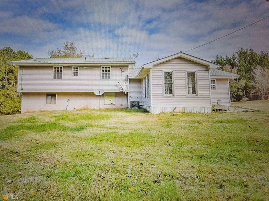 Cute split level, well maintained turn key home.  Features large living area, large great room with island in kitchen.  Electric range, modern refrigerator, microwave and dishwasher, tile floors and laminated shelves and off white cabinets.  Bedrooms upstairs with one office space overlooking roadway.  Masters features a large shower, laminated shelves and wooded cabinetry.  Two other large bedrooms.  Homes also features a sunroom that is warm in the winter with added heat and cool in the summer.  Home is situated on 4 acres and has a large shop that may be used in the back.