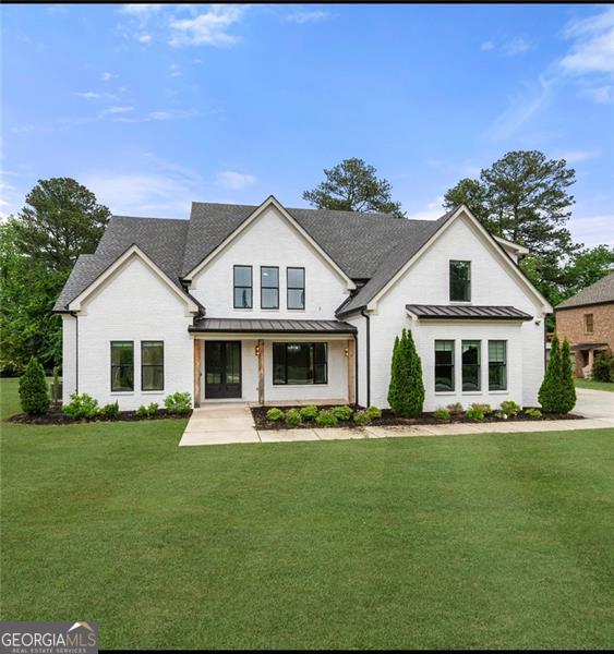 Welcome to 1375 Harris Rd-A Hidden Gem in the heart of Lawrenceville! This beautifully maintained home blends comfort, space, and style. Nestled on a generous lot, this property offers both privacy and convenience-just minutes from schools, shopping, dining and major highways. Step inside to find a spacious, light-filled interior with an inviting layout perfect for entertaining or everyday living. The kitchen is a chef's dream with modern appliances, ample counter space, and views into the cozy living room. Whether your hosting friends or enjoying a quiet night in, this home delivers. Retreat to the serene primary suite with its own private bathroom and walk-in closet, while the additional bedrooms offer flexibility for guests, family or home office. Enjoy the outdoors year-round with a large backyard-ideal for gatherings, gardening, or simpy relaxing under the Georgia sky. This home is everything you've been looking for and more. Schedule your private tour today!