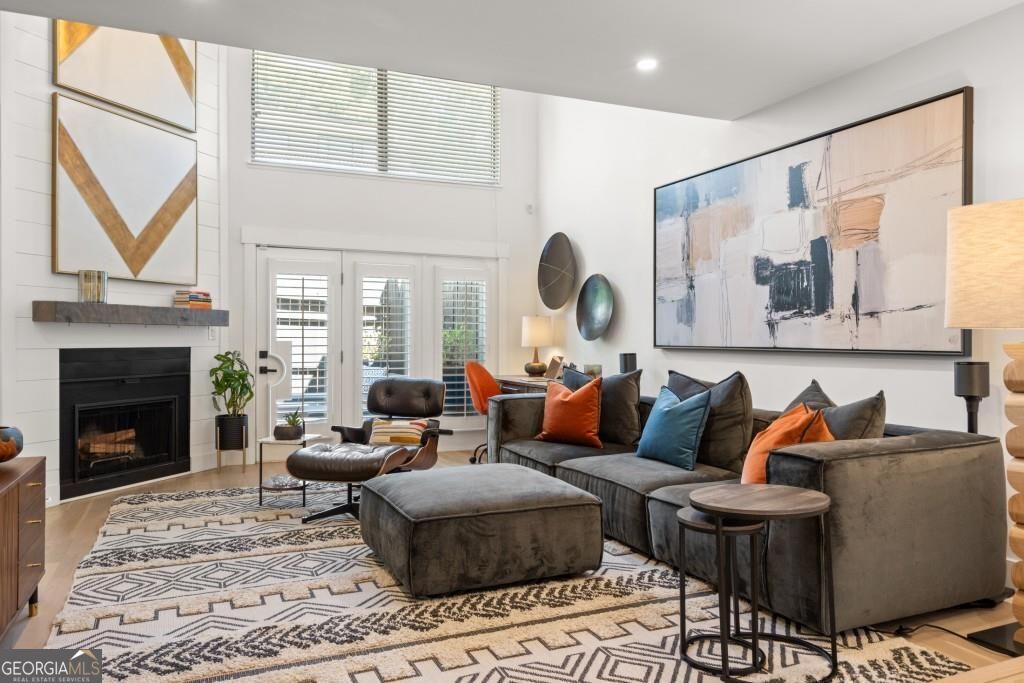 A beautiful, fully furnished 3 bedroom, 2.5 bathroom townhouse in the historic Old Fourth Ward Neighborhood of Midtown Atlanta. The 3 story townhouse with a private garage has been totally remodeled and professionally decorated. On the main level, a family room (with an 85" flat screen television and Sonos surround sound), dining area, and remodeled kitchen with quartz counters allow for easy living and entertaining. A full laundry room and half bathroom are easily accessible on this level as well. A very private primary suite with king bed, ensuite bath with walk-in shower, dual sink vanity and fifteen feet of closet space is located within the primary suite. On the third level, two additional bedrooms (both with queen beds and ample closet space in each) share a full bathroom with tub/shower combination. All three bedrooms provide blackout curtains for restful sleep and privacy. Laminate wood flooring is used throughout the public spaces and primary bedroom and new carpet has been added in the two secondary bedrooms. Finally, a private outdoor garden space with dining table, Weber grill and comfortable sofa and club seating is beautifully decorated and perfect for evening gatherings and al fresco dining. A Sonos music sound system extends throughout the home and a spin bike is available in the garage for use. Two desks: one electric stand-up desk in a secondary bedroom and one in the family room with available high-speed internet to facilitate easy remote work. The townhome community has concrete firewalls between units preventing noise from the neighboring units. Located on a quiet street near Peachtree Street and North Avenue, the home is conveniently located in the vibrant Midtown and Old Fourth Ward neighborhoods within walking distance to Ponce City Market, the Beltline, The Fox Theater, Central Park, Piedmont Park, and Emory Midtown hospital. A community dog park, Publix, Walgreens, and public tennis/pickleball courts are a five minute walk away. The home also provides easy access to Virginia Highlands, Ga Tech, downtown, and I-75 I-85.