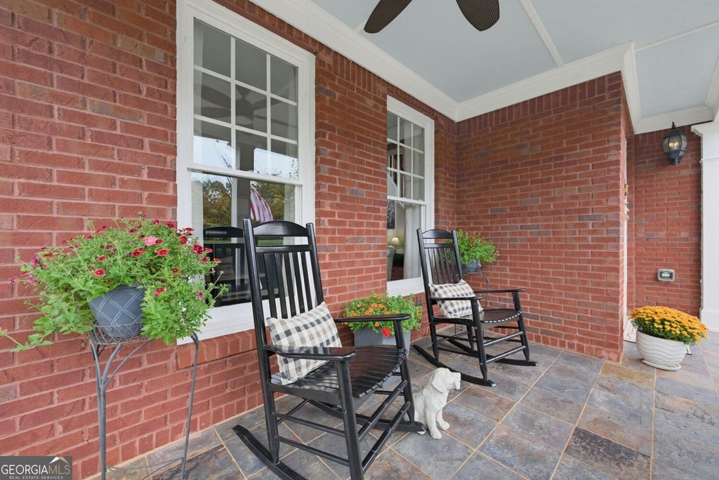 Photo of 6590 Grand Magnolia Drive NE, Sugar Hill, GA 30518 (MLS # 10869098)