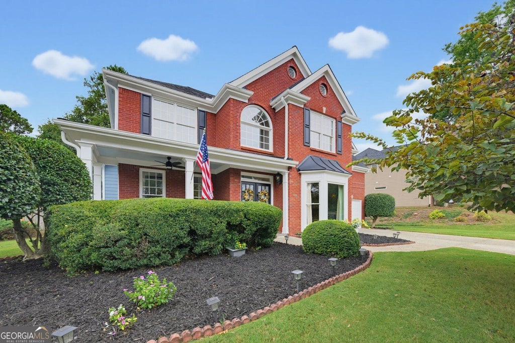Photo of 6590 Grand Magnolia Drive NE, Sugar Hill, GA 30518 (MLS # 10869098)