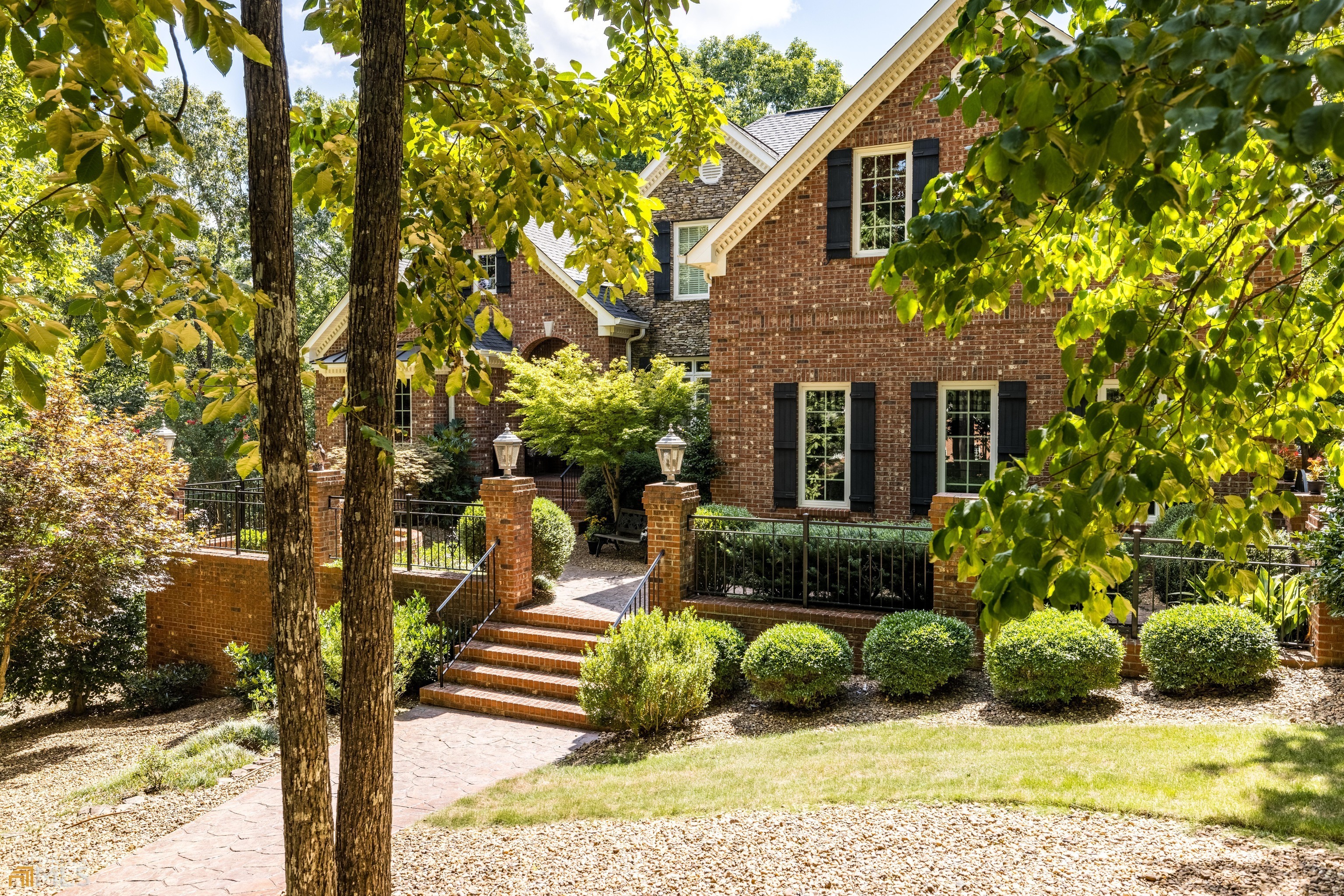 Gorgeous custom-built brick home on over 3 acres in High Pointe subdivision. Two story entrance foyer is adjoined by a beautiful library/study and a large dining room. Brand new kitchen and keeping room with new floors, cabinets, island, and stainless steel appliances. This kitchen is beautiful! Large master bedroom on the main level with completely remodeled master bath. Four bedrooms upstairs, each having private access to a full bath. On the terrace level is a screen porch, home theater, game room, kitchenette, and full bath. Hardwoods, tile, and marble are found throughout the home. Enjoy fall and spring season on your beautiful brick patio with masonry fireplace which awaits you just off the kitchen and keeping room.