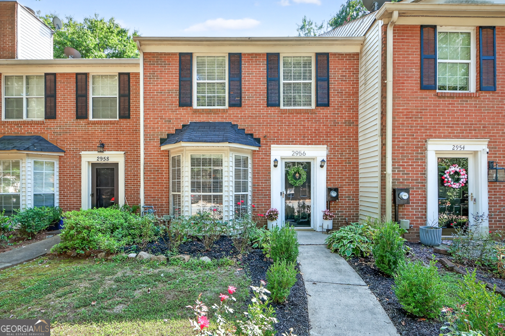Welcome home to this stylish brick-front 2 bed / 2.5 bath townhome with NO HOA and NO rental restrictions-a rare find in Smyrna! This property perfectly blends charm, comfort, and convenience. Step inside to discover a bright, open floor plan filled with natural light. The spacious living room features a cozy fireplace and flows seamlessly into the dining area-perfect for entertaining or quiet nights in. The renovated kitchen showcases white cabinets, stainless steel appliances, and a breakfast nook with bay windows, offering a cheerful spot to start your day. Upstairs, you'll find two oversized bedrooms, each with its own updated en-suite bathroom-ideal for privacy and comfort. The conveniently located upstairs laundry makes everyday living a breeze. Outside, enjoy a private deck and backyard space-perfect for morning coffee, grilling, or relaxing outdoors. With stylish updates throughout, this move-in ready home is just minutes from I-75, I-285, Smyrna Market Village, The Battery, and Cumberland Mall. Don't miss your chance to own this beautifully updated townhome in one of Smyrna's most desirable locations!