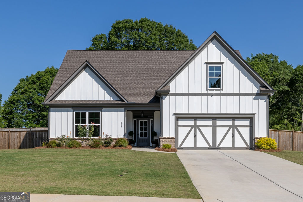 Welcome to this beautifully designed ranch in the quiet Dunagan Farms community of Winder! Built in 2023 by Porch Light Community Builders, a local and reputable builder who pays close attention to quality and detail. This thoughtfully crafted home blends modern comfort with timeless style in a quaint neighborhood! Step inside to an open, airy layout featuring upgraded luxury vinyl plank flooring throughout the main level- the only carpet is in the cozy bonus room!The dreamy chef's kitchen is equipped with a large island, upgraded quartz countertops, KitchenAid appliances, tiled backsplash, wall oven, and great pantry! The open concept living area features an electric fireplace with custom built bookshelves, adding both functionality and character! Wonderful primary bedroom with trey ceilings and lots of natural light! The primary bathroom has a tiled shower with frameless shower door, separate soaking tub, and double vanities! Upstairs you will find a bonus room; perfect for guests, hobbies, or play room! Also upstairs is a full bathroom, closet, and extra attic space for storage! Outside, spend evenings under your covered porch. Enjoy low maintenance landscaping with front and rear irrigation, solar landscape lighting, and a fully fenced backyard that's perfect for relaxing or hosting! Dunagan Farms offers a warm, welcoming atmosphere just minutes from local shops, parks, and schools. Convenient to Highway 316 and 85! This home is part of Jackson EMC "Right Choice Homes" program which means the home is more energy efficient and earns the energy advantage rate which saves money for the life of the home! Don't miss the chance to make this move-in-ready gem your new home!