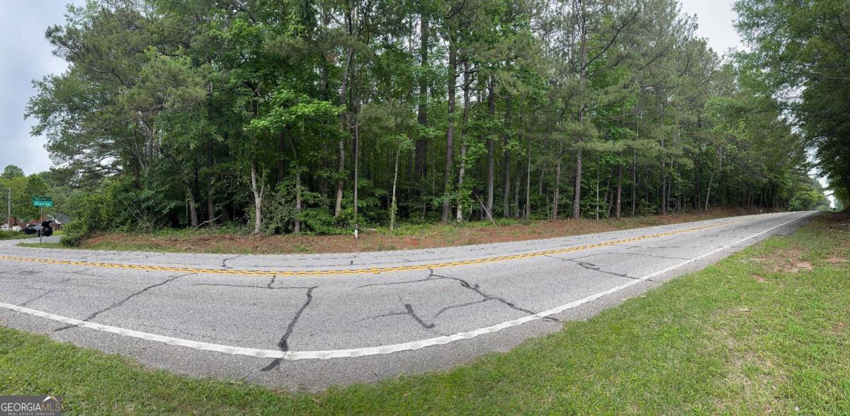 Prime Commercial Corner Lot Co 2.33 Acres with Excellent Road Frontage and Visibility Opportunity awaits with this 2.33-acre parcel of raw land, ideally positioned on a high-visibility corner lot. Featuring approximately 402 feet of road frontage, this property offers exceptional access and exposureCoperfect for a wide range of commercial developments. Zoned B-1, this versatile site is suited for retail, office, service-oriented businesses, or mixed-use projects, subject to local zoning guidelines. The lot is naturally wooded with a beautiful mix of mature hardwoods, offering a scenic backdrop and potential landscaping value for future development. Whether you're an investor, developer, or business owner seeking a prominent location, this property combines visibility, accessibility, and commercial potential in one outstanding package. Don't miss this rare chance to secure a strategic commercial lot in a growing areaCoyour future business starts here.