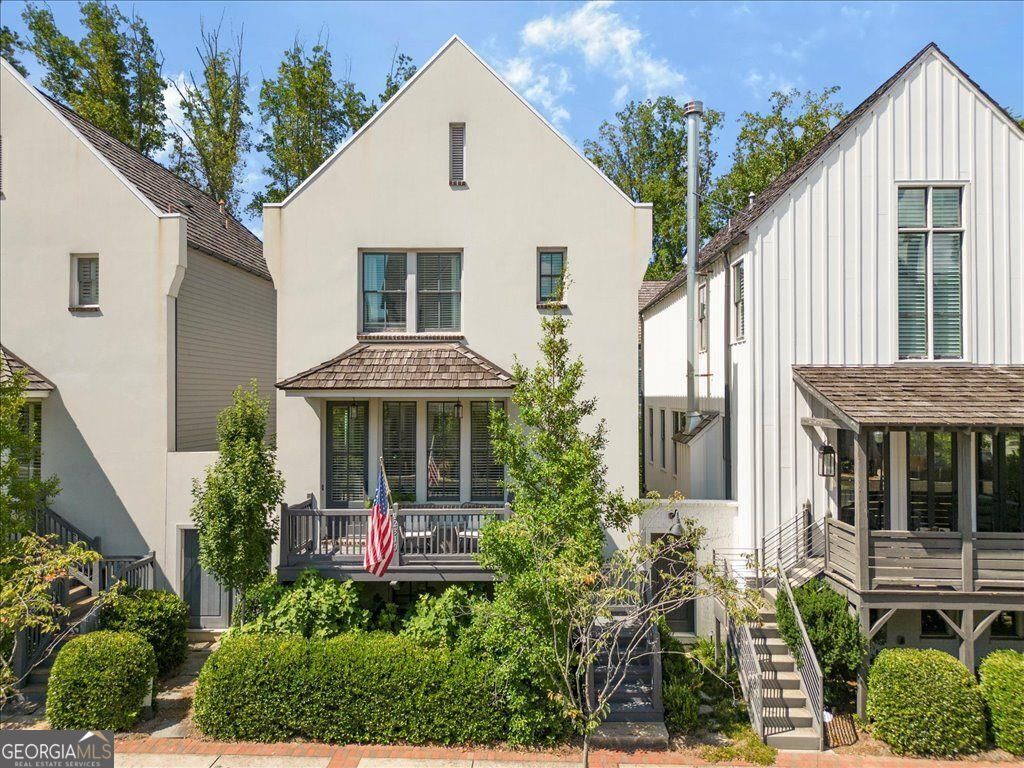 Welcome Home! Situated in the heart of the Alpha Loop, this home offers convenient access to some of Alpharetta's most popular destinations. 0.6-mile to Avalon, known for its theater, dining, shopping, and year-round events, and just 0.2 miles to Downtown Alpharetta, home to more than 30 chef-driven restaurants, boutique shops, a seasonal farmers market, and community festivals. Voysey, a Hedgewood Homes community, is recognized for its French-inspired architecture, shake roofs, and thoughtfully designed streetscapes. The covered front porch opens into a light-filled, open-concept main level featuring a spacious living area, dining space, new dry bar and a chef's kitchen appointed with Quartzite countertops, stainless steel appliances, spacious pantry, and an island with seating. The upper level includes the primary suite with marble-topped dual vanity and a seamless glass-tiled shower, plus two secondary bedrooms sharing a full bath. The finished terrace level offers an additional en suite bedroom along with space suitable for a home office or fitness area. Additional features include hardwood flooring on all levels, a 2-car garage with storage, and proximity to highly rated schools.