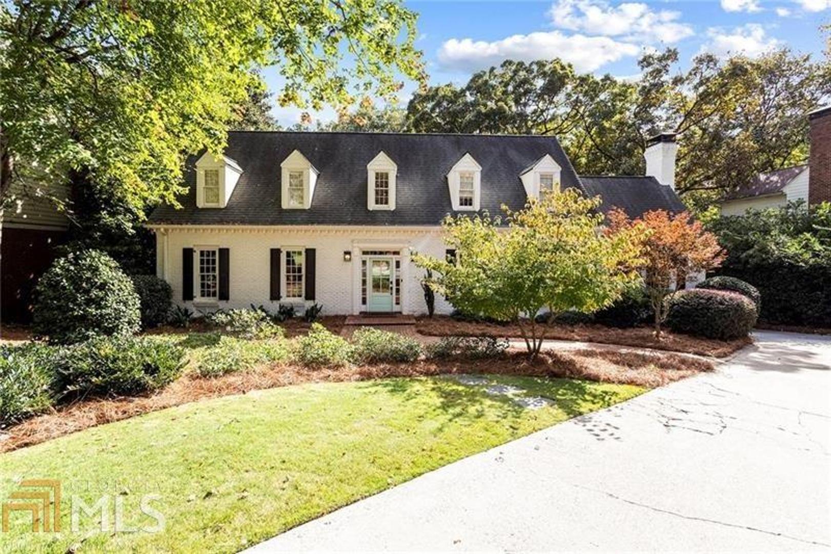 This is a completely updated open, light and bright home. It sits on a lush half acre lot. High ceilings, modern open floorplan, clean lines, light wood floors throughout, large deck and outdoor spaces as well as walkability to the best of Historic Vinings. Owner Suite up has a great contemporary vibe with 2 additional oversized bedrooms rooms. The 4th bedroom is a guest room on the main. Main floor also includes an ideal work from home/formal library and beautiful sunroom overlooking lush backyard. Additionally, the kitchen has high end stainless appliances and is open to the fireside family room. Finished basement has great open bonus space, perfect for indoor games, exercise or additional sleep space with closet and full bath. Painted brick home has 3 car garage is ideal for storing oversized SUV as well as a workshop or storage space. This is a great house on a great street and is a wonderful opportunity to be in renovated home in Vinings for under 1 million.