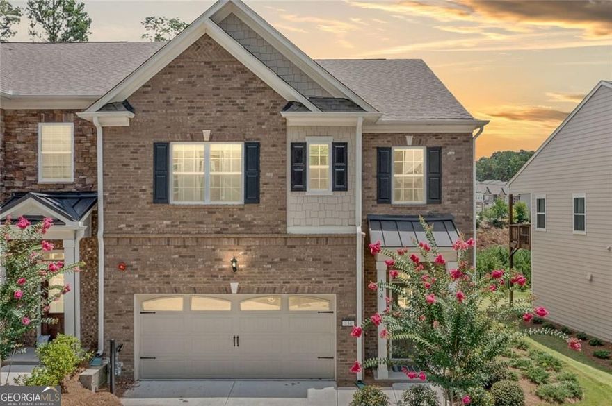 Modern design, natural light, and all the right upgrades, this 2023 build delivers the feel of new construction without the wait.  From the moment you walk in, the open layout feels effortless. The kitchen features quartz counters, herringbone tile backsplash, stainless steel appliances, and a four-seat island that's made for everything from casual breakfasts to evening wine with friends. Wide-plank floors run throughout the main level, connecting the living and dining spaces with clean lines and warm tones. Custom automatic blinds add a seamless, high-end touch to the main living areas.  The living area is styled with oversized windows and a painted brick fireplace flanked by custom shiplap accents, bringing both character and comfort. French doors lead out to a fenced backyard with wooded views and no direct neighbors behind you.  Upstairs, the primary suite goes beyond the basics with a private sitting area or office nook, two walk-in closets, and a bathroom that feels like a retreat. Think dual vanities, marble-look tile, a soaking tub, and a glass-enclosed shower.  Tucked in a well-maintained community just minutes from Highway 92 and I-575, this home has a smart design with everyday functionality. Stylish, practical, and truly move-in ready.