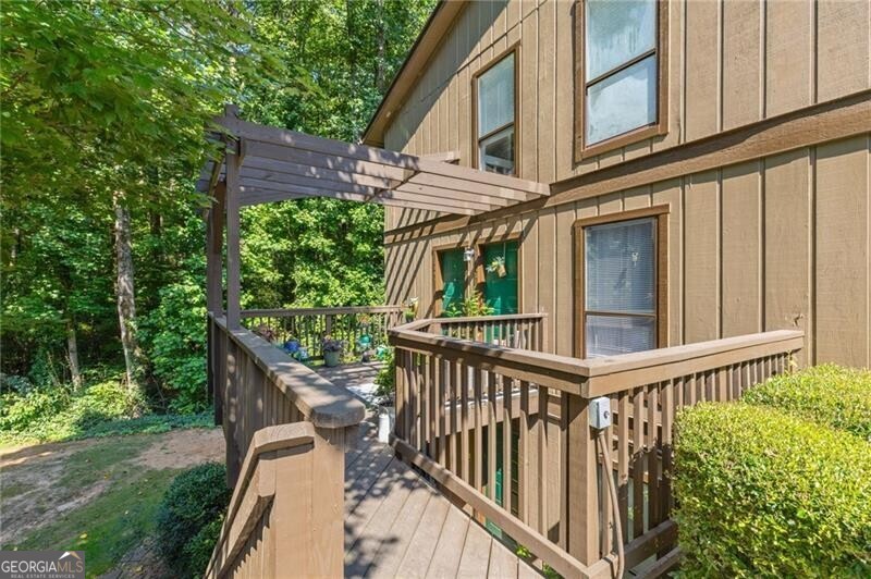 Nestled in the heart of Tucker, GA, you'll find the inviting haven of 3845 Cedar Circle. This delightful top floor home has an open floor plan with tons of natural light, new luxury vinyl flooring, an updated bathroom, and a brand new gas stove and microwave. As you step inside, there's an extra space under the stairs which can be used as an office. Once you walk up the modern staircase, you'll love the large den that has a cozy fireplace and built in bookshelves. One of the most enchanting features of this property is the screened in porch, which extends from den and offers a serene escape with its picturesque views of the wooded backyard. Whether you're sipping your morning coffee or hosting a weekend barbecue, this space is a true retreat. With no rental restrictions and detailed maintenance records available, this condo offers peace of mind whether you're planning to call it home or rent it out. The transferable home warranty covers all major systems, including HVAC, appliances, and electrical, adds an extra layer of protection. Water and Trash are included with HOA. Located within a half mile of Hwy 78 and I-285, and close to Northlake, Decatur, and Emory, Cedar Circle offers both convenience and community. Enjoy the amenities including aswimming pool and tennis courts while surrounded by beautifully landscaped exteriors that reflect the pride of this friendly neighborhood.