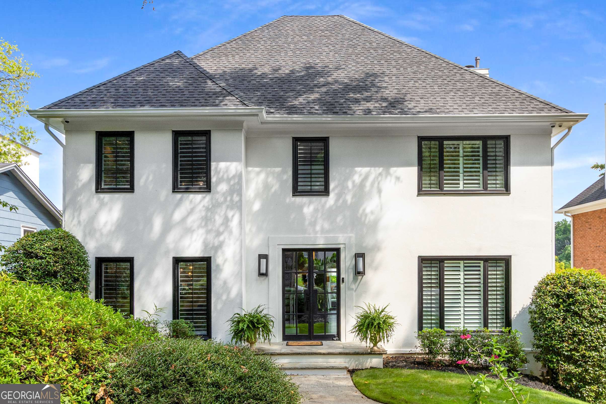 This home is perfectly positioned in the highly sought-after coveted Morningside school district in a neighborhood offering unbeatable walkability to the serene Morningside Nature Preserve, Sprouts, Piedmont Park, Top restaurants like 6 feet Under, The Colonnade, Ninos Italian, Taqueria de Sol. As you drive up you will marvel at the curb appeal the home exudes with Modern double Black Iron doors, New black windows and plantation shutters offers sophistication and elegance to the home. You will be greeted with warmth from the incredible light-filled brightness as you enter the foyer with a view of the spectacular wall to wall Panoramic bifold doors in the great room leading to a large backyard patio ideal for entertaining. The spacious layout boasts a gracious living room with shelving and built-ins, gas fireplace, separate dining room, formal living or flex space for office. Beautiful hardwood floors throughout & double crown molding. The heart of the home offers white kitchen cabinets, quartz countertop, white modern backsplash, SS appliances with Gas cooktop, breakfast area with custom built-ins for extra storage. Retreat upstairs to relax in the oversized private primary suite with an envious custom walk-in closet that is just to die for as well as another additional closet, Large spa-like ensuite bath featuring soaring vaulted ceilings, double vanities, soaking tub, and separate shower and private water closet. To complete the upstairs there are 2 additional generous secondary bedrooms and updated hall bath with double vanity, tub/shower combo. The floorplan ensures space and comfort for family or guests. Downstairs offers a fully finished terrace level with room to use as another bedroom, office or theatre and Full bath. Enjoy an abundance of natural light in the day-lit basement. Walk outside you will find an attached 2 car garage and an Additional Rare detached 2-car garage or Workshop with 220 voltage. Don't miss your chance to live in one of Morningside's most beloved neighborhoods and call it HOME.