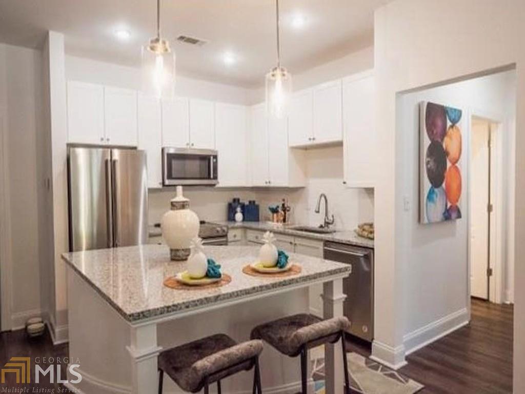 Available April 1st. 2/2 modern new construction condo in historic Grant Park! Easy access to interstate, Beltline, the Beacon, restaurants and nearby amenities. Close to downtown and Midtown. 2nd fl facing beautiful neighborhood, stainless steel appliances, granite counters, pet friendly, W/D, oversized closets, building security system, 2 assigned parking spaces, gym (no need for gym membership!). Gated community. No Section 8 or Atlanta Housing Voucher.