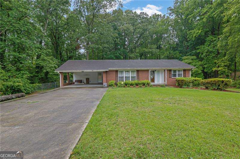 Nice, well-built 4 sides brick ranch on double lot. 3 bedrooms 2 bath home in quiet neighborhood without an HOA. Home features original hardwood floors, kitchen with white cabinets and granite counters. 3 Spacious bedrooms, family room, den with fireplace, dining room, utility room and laundry all on 1 level. Outside enjoy the covered patio and fenced backyard. Great value. Book your showing today