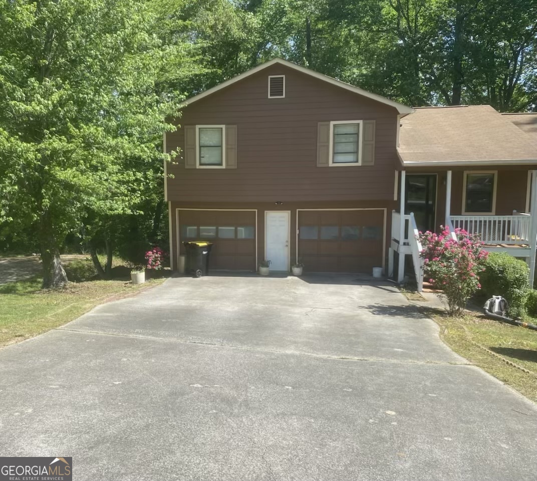 Tucked away in a quiet, tree-lined neighborhood, 104 Shannon Chase Way offers a unique opportunity for homeowners or investors seeking space, income potential, and room to grow. This charming two-story home, built in 1990, sits on a generous .35-acre lot and features 3 bedrooms, 2 full bathrooms, and over 1,500 square feet of living space. Inside, you'll find a bright, functional layout that includes a formal dining room for gatherings and a sunroom filled with natural light-ideal for relaxing or working from home. One of the standout features is the attached ADU studio, perfect for generating rental income, hosting guests, or creating a private home office. A partially finished basement offers even more flexibility-great for a gym, playroom, or future expansion-while the attached two-car garage provides convenience and storage. With a little TLC, this home presents tremendous value and potential. Whether you're looking to customize your dream home or invest in a property with upside, this Fairburn gem is full of opportunity.