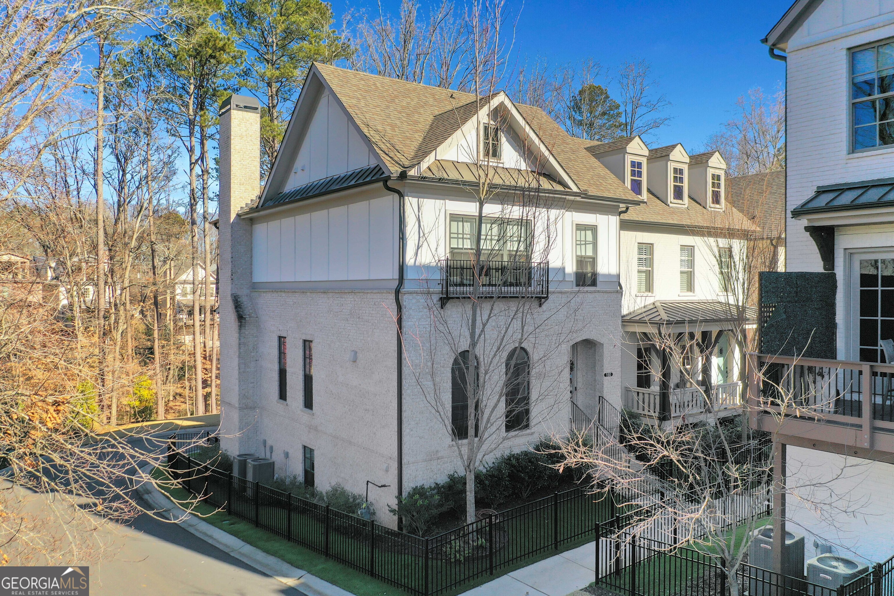 Stunning residence located on a corner lot in the heart of downtown Alpharetta, within the highly sought-after East of Main neighborhood. This home perfectly blends modern luxury and urban convenience. Inside, an open-concept layout boasts abundant natural light, designer finishes, custom beams, new light fixtures, and accent walls, creating an inviting atmosphere of elegance and comfort. The modern kitchen features sleek appliances, quartz countertops, custom cabinetry, and ample storage, seamlessly flowing into the expansive family room anchored by a cozy fireplace and screened porch, ideal for relaxation and entertaining. With four bedrooms and four bathrooms, the luxurious master suite includes a spa-like ensuite with a soaking tub, dual vanities, and a spacious walk-in closet with custom built-ins. The downstairs bedroom and bathroom provide a perfect retreat for guests or a home office. Step outside to enjoy the serene screened-in porch, while the turfed, fenced front and side yard enhances the home's curb appeal and offers a low-maintenance outdoor space. Additional highlights include a newly epoxy-coated garage floor and large attic storage. Located just minutes from Alpharetta's lively dining, shopping, and entertainment scene, as well as the Alpha Loop, as always something to enjoy. Whether you're strolling to the farmers market or attending a Friday night concert, East of Main offers a vibrant community with endless activities. Don't miss your chance to make this dream home yours!