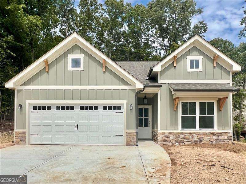 Great True Ranch Plan with Charming Covered Front Porch with 3 Bedrooms 2 Bath Open Floor Plan, Rear Covered Deck with Beautiful Wooded Mountain Views, Gourmet Kitchen with Granite Counters and Loads of Cabinet Space. Private Master Suite with Double Vanity, Walk In Closet and Spacious Shower. Ready December 2025. Come out and see why Lake Arrowhead has been voted TOP BEST 100 PLACES TO LIVE.
