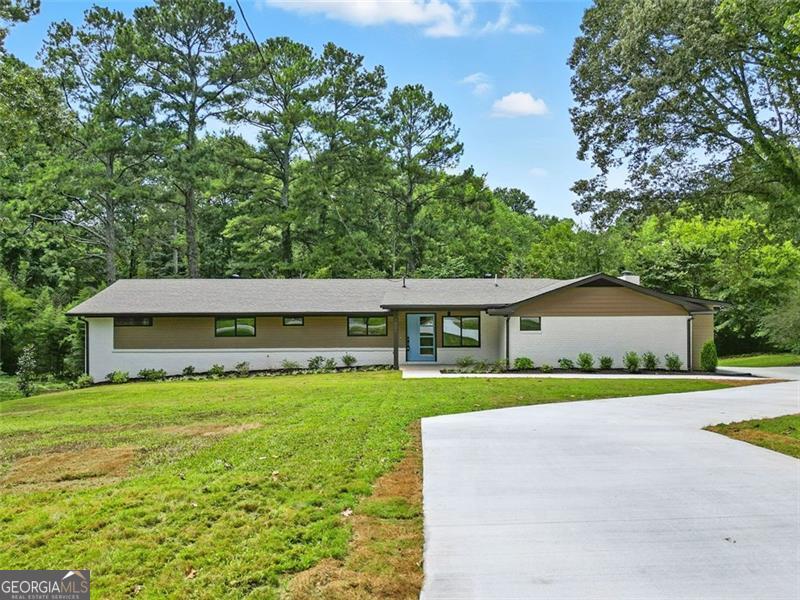 Welcome to this stunning, fully renovated 5-bedroom, 3-bath ranch home that truly has it all. Situated on just under an acre of flat, level land, this property offers the perfect blend of comfort, space, and convenience. Step inside to a bright, open floor plan featuring a huge great room with soaring cathedral ceilings, creating an airy, inviting space ideal for gatherings or quiet evenings at home. A brand-new deck extends just off the great room, offering seamless indoor-outdoor living and the perfect spot for entertaining or enjoying peaceful mornings. The home has been thoughtfully updated throughout with brand-new HVAC, plumbing, lighting fixtures, all new windows and plumbing fixtures. The full finished basement provides an abundance of extra living space-ideal for a media room, home gym, or guest suite. Car enthusiasts and hobbyists will love the 4-car garage and the expansive workspace, perfect for all your projects. Outside, the generous yard offers endless possibilities, from gardening to outdoor entertaining, all set on a beautifully level lot. Located just minutes from shopping, restaurants, parks, and entertainment, this move-in-ready home delivers modern style, thoughtful upgrades, and an unbeatable location. Don't miss your opportunity to make it yours! Seller is offering 5.875 % interest rate for qualified buyers that use our preferred lenders.
