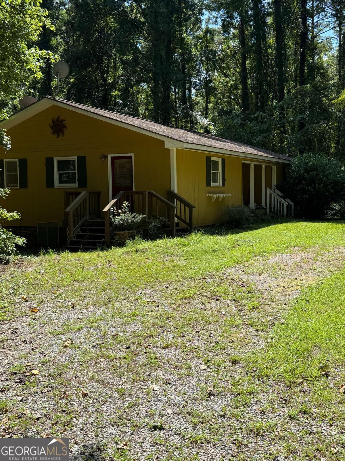 Here's your opportunity to own your slice of heaven on the lake! Super private cottage with over 2 acres on Lake Sinclair. With a bit of sweat equity, you can build some great value in this home. This property has 3 bedrooms and 2 full baths, with some fairly recent renovations in the kitchen and bathrooms. The house has some great bones! Nestled on a wooded lot full of nature and serenity.