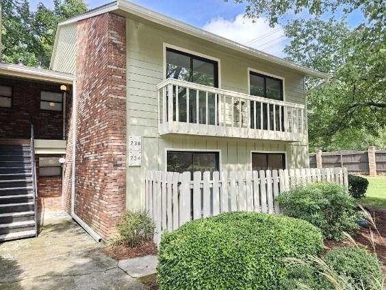 This updated condominium has so much to offer! 2 bedroom/ 2 full bath. The kitchen features new stainless steel appliances and new granite countertops. Other updates include: new roof, new siding, new paint throughout, and new LVP flooring. The living room has a beautiful wood burning fireplace. Exterior features: 2 outdoor storage closets, 2 parking spaces with ample guest parking, and a balcony in the front and back of the condo. Location, location, location! 10 minutes away from Truist Park and even closer to I-75, shopping and great restaurants.