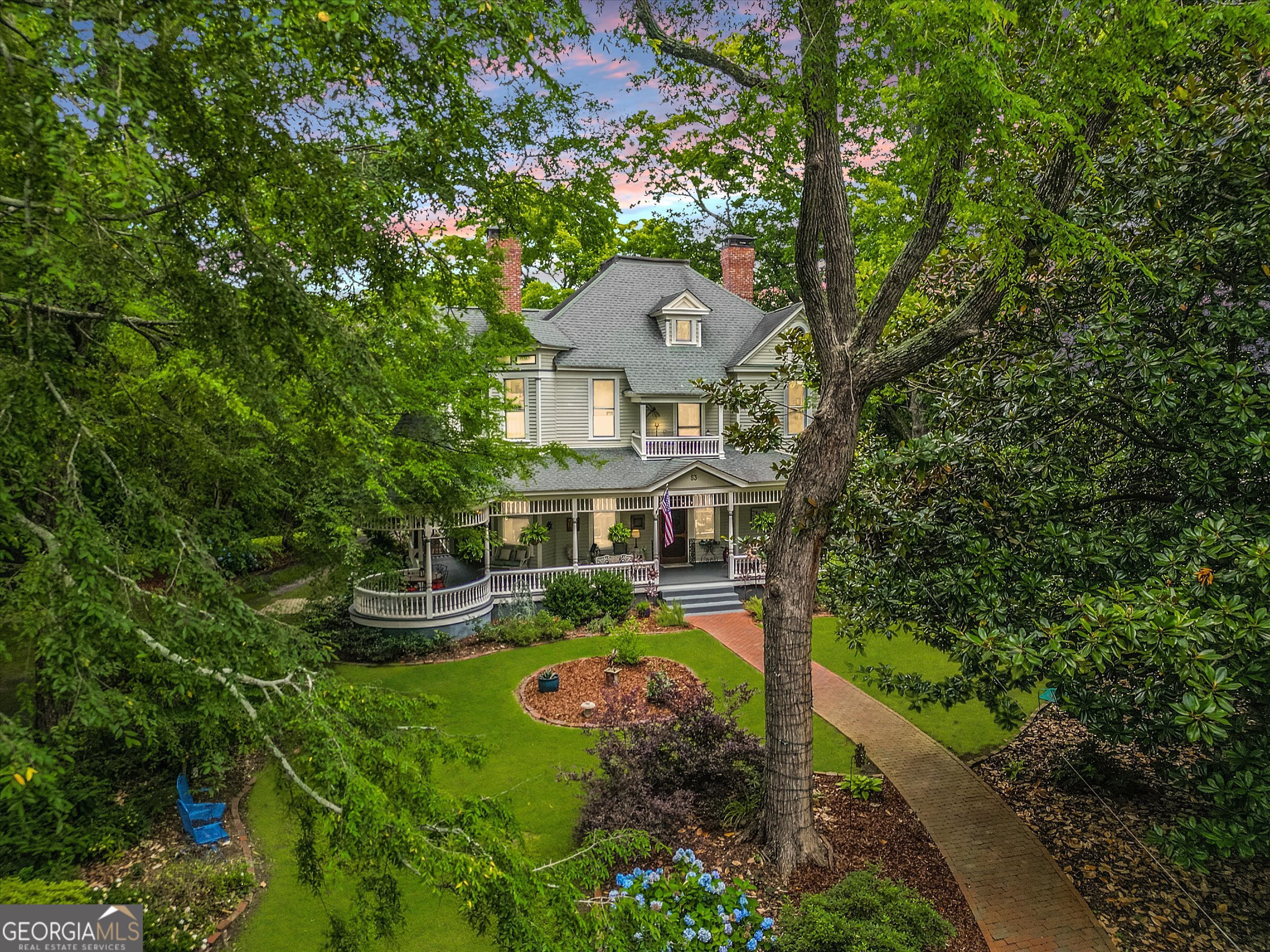 **SEE OUR VIDEO HOME TOUR IN "View 2nd virtual tour" BELOW!!** **The Born House: A Timeless Masterpiece in Historic Norcross** Step into history with this stately Farmhouse-style Queen Anne Victorian tucked away on a large lush private corner in downtown Historic Norcross. This home was originally built in the 1870s as a humble two-room cottage without indoor plumbing or electricity and later (in 1886) transformed into the elegant Victorian Home it is today. The Born House now captivates with a large wrap-around porch, central hallway, and original heart pine floors that echo its storied past. The home proudly showcases eleven-foot ceilings, massive newel posts, and natural wood trim-a beautiful blend of historic charm and modern craftsmanship that has been lovingly restored over years by devoted owners. The property carries a fascinating legacy. It has been featured in various films, magazines, books, art installations and home tours. Each thoughtful restoration preserves the home's heritage while infusing it with contemporary comforts. Whether it's a quiet morning on the inviting porch or an evening spent in a room that resonates with antique allure, this lovely home offers a living story where every detail has been meticulously curated. Embrace the rare opportunity to own a piece of Norcross history-where timeless elegance meets modern living. This home invites discerning buyers who value character, heritage, and the beauty of thoughtful restoration. Seller will also consider package offer on the adjacent buildable .402ac lot at 63 Born St for an additional $275,000. This combination would bring the total acreage to 0.837ac.