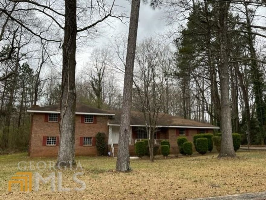 Hot Property! Make offer today!!! Great private setting. All brick 4 bedroom 2 bath with a ton of living space, just needing that personal touch! New appliances, front door, soffit, etc. Separate living room, dining room and breakfast area. Family room with fireplace downstairs. Rear entry garage converted to a large bonus room-buyer could re-convert it. The tax records do not reflect the finished lower level. Lockbox is on the front porch rail. Text agent for showing-Do NOT use Showing Time.