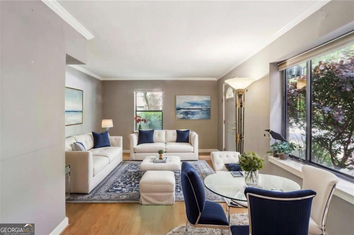 This is a great "FIND" in a Midtown Garden District condo unit. It's the size of the typical 2-Bedroom above it, but with a 1-Bedroom monthly condo fee ($200.02 per month). Live in it as a 2-Bedroom, or 1-Bedroom Den, Office, Guest Room, etc. Good bones in that Kitchen and Bath were already renovated well after the 1999 conversion from apts to condos. Priced to reflect the need for TLC in paint and floors. The 2nd Room was previously made into a walk-in closet/dressing room. Leave it or use it as you wish. Private 1st Floor Entrance and side Kitchen Door. New Stove. Recent HVAC system and Hot Water Heater. Excellent Melrose Park complex location in tree-lined neighborhood. Lots of windows for generous natural light. A gem of a community only blocks from Piedmont Park (7 blocks), GA Tech (1.2 miles), GA State (1.7 miles), Emory University (3.9 miles), The Beltline (0.9 miles), Ponce City Market (5 blocks), The Fabulous Fox Theatre (5 blocks), North Avenue MARTA (6 blocks), Grocery, Pubs, Restaurants, and More! It's all happening in Midtown Atlanta.