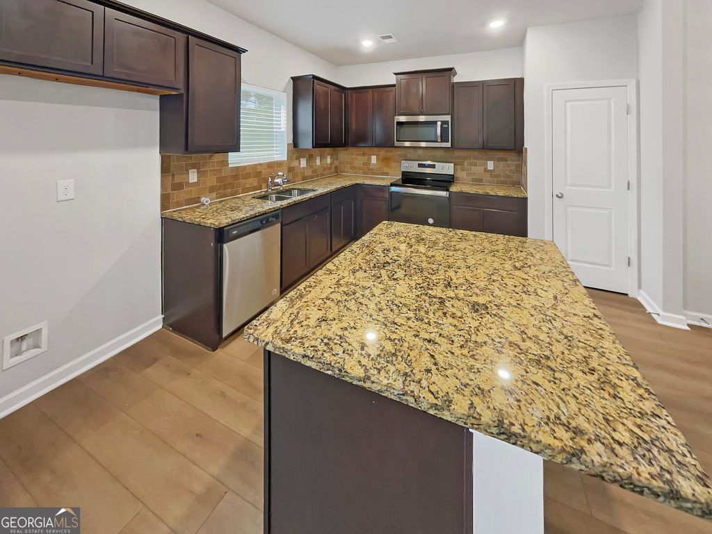 Photo of 11911 Lovejoy Crossing Way, Hampton, GA 30228 (MLS # 10671422)